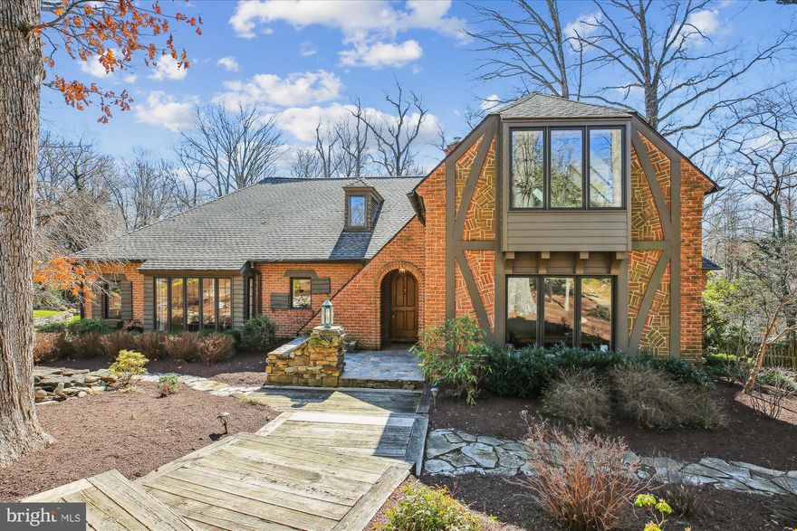 Spectacular Custom Built Private Oasis in sought after Manor Country Club Community.  Gorgeous all brick home on just under .9 acres with 4 spacious bedrooms, 3 1/2 baths and 2 car side-load garage.  Home features soaring 20 ft. cathedral ceilings in the Great room with a fabulous stone fireplace, recently renovated gourmet kitchen with a beautiful center island, gas range & stainless steel appliances.  Home also has updated baths, 3 fireplaces, enormous finished basement with a rec room, gym, music room, sauna, full bath & workshop area.  Expansive rear deck overlooks the picturesque private lot.  Quality craftsmanship can be seen in every inch of this well maintained home.  Country Club Membership conveys.  This home has it all!