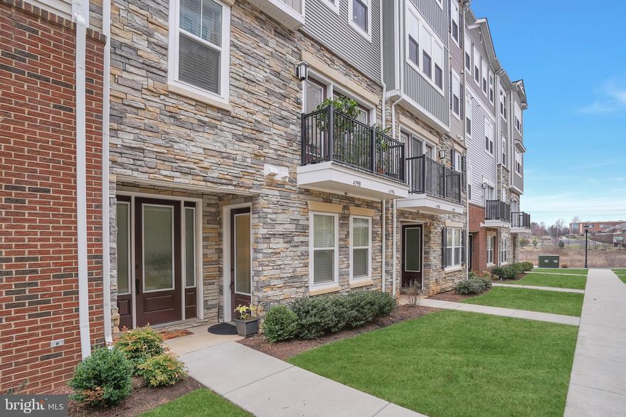 Walking distance to Stone Ridge shops and parks, this stunning 2-level townhouse-style condo perfect blend of space, luxury, accessibility and convenience with 3 bedrooms and 3 full bathrooms.  Built in 2020, the first level is custom desiged from the original builder for accessibility. The first floor has oversized full bathroom, laundry closet (prewired), lowered countertops in the kitchen and easy access to the garage.  Upon front entry is an open-concept main living area with an upgraded kitchen boasting granite countertops, white soft-close cabinets, stainless steel appliances. The expansive primary suite on the second level serves as a private retreat with two walk-in closet, a juliet balcony, and a spa-like en-suite bath featuring a soaking tub, separate shower, and dual vanities. The other two generously sized bedrooms are perfect for family, guests, or a home office.  The second level has another laundry closet with side by side front load washer and dryer.  Additional highlights include a one-car attached garage, one car driveway, a walk-in pantry, and hardwood floors throughout the first level. Stone Ridge has amazing amenities, including 3 pools, clubhouse, tot-lot, fitness center, tennis courts, and scenic hiking trails. Byrne Ridge Park is also walking distance.  Conveniently located near Route 50, the Dulles Toll Road, and the future Silver Line Metro.