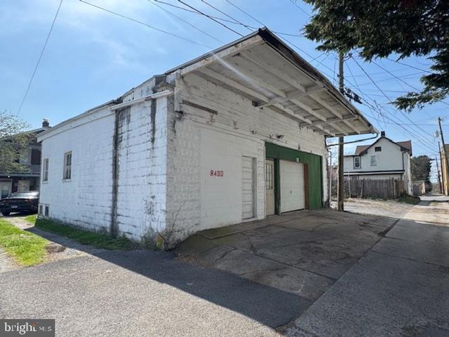 RARE GARAGE SPACE OPPORTUNITY located in alley behind 400 W. Howard Street.   Two levels equaling over 3000 square feet, ideal for warehouse storage, auto repair/storage, woodworking, contractor storage space...or whatever your needs may be.  Solid concrete block building with electric and concrete floors on both levels.  Sold strictly AS-IS.  Tenant occupied and will require at least 24 hours to coordinate for showings.  This is an exceptionally rare chance to acquire large, versatile garage spaces in the city of Hagerstown.  As information and listed separately the garage directly next to this one ((743 Guilford Ave Rear)  MDWA2035436, is also for sale and offered at $60,000.  Opportunities like this don't come around often to own two spacious garages, positioned side by side in the city of Hagerstown and offering exceptional flexibility for a variety of uses.