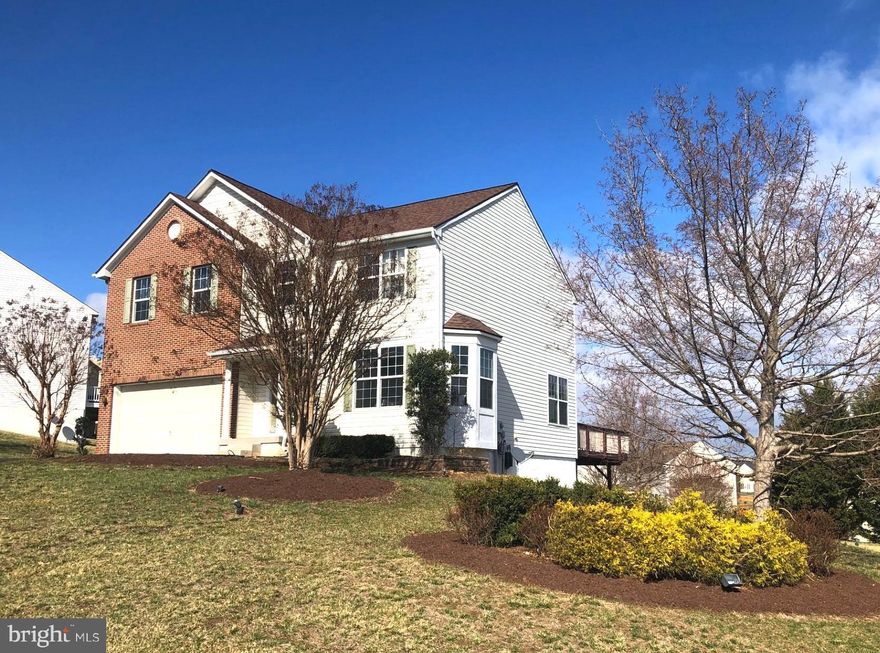 Move in Ready  Home  just minutes from  downtown Historic Harpers Ferry and the State Lines of Maryland and Virginia. This stylish home was a former model for this community and  features custom moldings and wall coverings and custom curtains throughout the home.  All curtains, pictures and furniture  convey. 
Plus, recent  upgrades include  a new roof , HVAC system,  new above grade carpeting, refinished hardwood floors, and an active radon system!  The main level features a spacious family room with gas fireplace that opens into the kitchen with granite counters and breakfast bar and gas cooking stove,  The slider door off of the kitchen nook  leads to the newly repaired  purple wood deck offering sweeping views of the distant mountains.  There is also  a powder room and private office.  The upper level features a large landing/loft area   with  shelving and entertainment center.   The spacious primary bedroom is 19X16 with walk in closets, and a primary bath with separate shower and soaking tub. There are two additional upper level bedrooms featuring  the  model home decorating touches, and the laundry room  is also upstairs.. The partially finished basement has another bedroom and a full bath, with a living area with walk-out exit to  a  paver patio.  Garage has small heating and cooling unit;  Property is located at the front of the community allowing for easy access to Rt 340.   Harpers Ferry features historic sites and recreational venues,  including hiking,  river rafting,  and tubing !