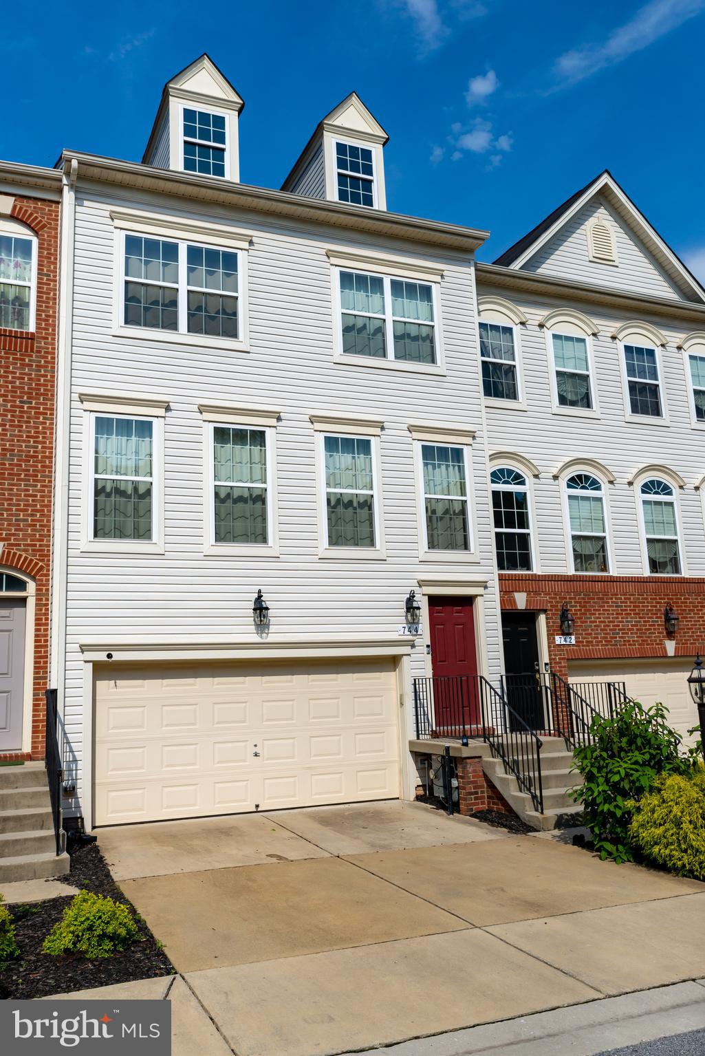 Check out this spacious 3-level townhouse with plenty of parking in the Millhouse Creek Community. A 2 car garage and 2 parking spots in front of the home. Beautiful hardwood floors on the main level. This open concept flows into the kitchen. Sliding glass doors provide access to a large trex deck. On the upper level, there are 3 bedrooms, 2 full baths and laundry area. The Primary bedroom offers a large walk-in closet, a large soaking tub, separate shower and double vanity. Two more spacious bedrooms with a hallway bathroom with double vanity and tub shower. On the lower level enjoy a recreation room and half bathroom. Just Minutes from Local, Waterfront Restaurants, Public Parks, and Baltimore Washington Airport!