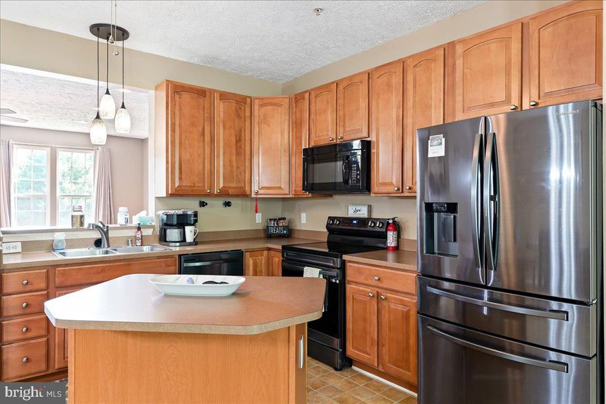 Nestled in the picturesque town of North East, Maryland, this charming three-story townhome offers a lifestyle that seamlessly blends modern convenience with the tranquility of a wooded  back yard setting. Located just a short distance from downtown, this residence provides the perfect balance of urban accessibility and natural serenity. T he exterior of the townhome boasts a low-maintenance design, allowing homeowners to enjoy their surroundings without the burden of extensive upkeep.
Step inside, and you'll find a thoughtfully designed interior spread across three stories. The first floor features a one-car garage, providing both convenience and parking.  Ascend to the main living area, where an open floor plan seamlessly connects the living room, dining space, and a modern kitchen. Large windows flood the space with natural light, creating an inviting atmosphere.   This home can potentially quality for up to 15K in incentives for first time buyers, restrictions apply.