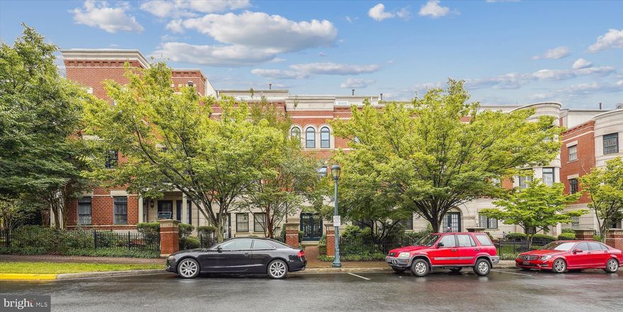 Beautiful Reston Town Center rowhome! 4 lvl BRICK townhome w/2 car attached Garage. Rooftop Terrace with city views! Impressive open floorplan with hardwood floors on 3 lvls.  Expansive kitchen with atrium breakfast nook, granite countertops/breakfast bar, and extended custom built-in cabinetry. Dining Room with beautiful tray ceiling and cove lighting opens to Living Room. Primary Bedroom with a wall of windows and sitting area. Bathroom with corner soaking tub, large glass enclosed shower and walk-in customized closet. Second bedroom with private updated full bath. Top level features built-in entertainment center, wet bar, vaulted ceilings. French doors open to airy rooftop terrace with views of city lights. Private West Market pool, sauna, gym, and clubhouse available. Enjoy all the amenities of the Reston Town Center just minutes away, but you are still able to enjoy the tranquil tree-lined streets and quick access to the W&OD trail. Live the Reston Town Center lifestyle from the quiet West Market setting!