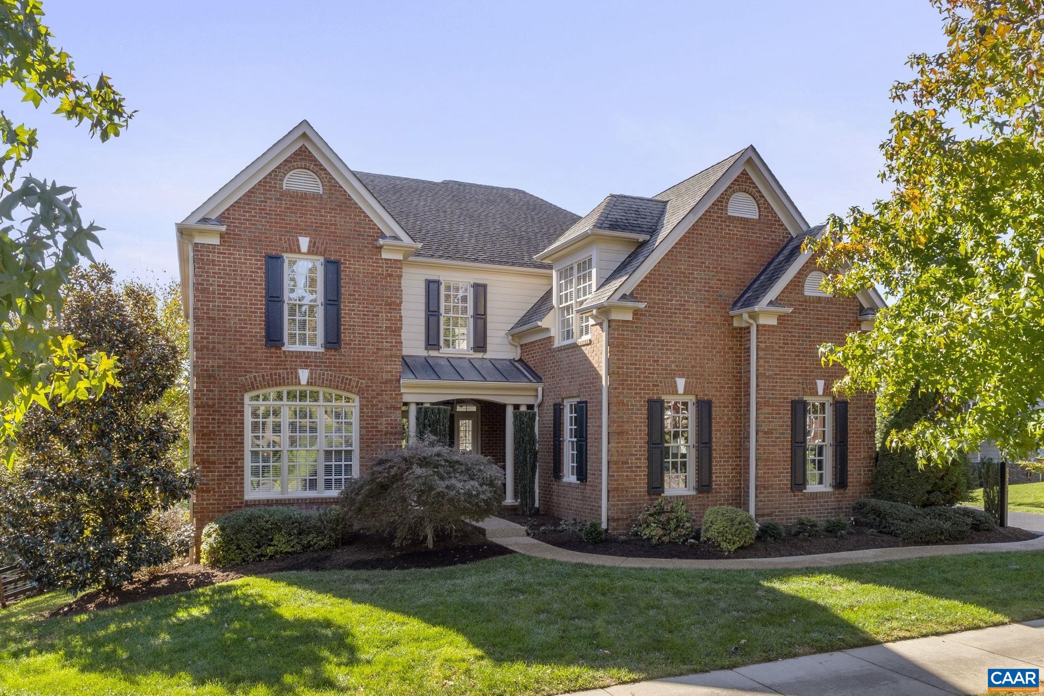 Experience high-end living in Creekside at Old Trail?Crozet?s most desirable neighborhood. This stunning all-brick home blends classic style with modern functionality, offering space to work, unwind, and entertain. Step into a dramatic two-story foyer that makes a statement from the start. Host dinner parties in the elegant dining room or take your Zoom calls in a private study with French doors. The open kitchen is built for effortless living, featuring granite countertops, stainless steel appliances, gas range, and a walk-in pantry, all flowing into a stylish family room with coffered ceilings, custom built-ins, and a cozy fireplace. Outside, an oversized deck is your front-row seat to winter mountain views, overlooking a fully fenced, professionally landscaped, and irrigated half-acre retreat. Upstairs, the primary suite is a true escape, with a sunny bathroom, walk-in closet, and a private lounge area. Four more spacious bedrooms?including a luxe en suite?offer flexibility for guests, workouts, or creative spaces. The walkout lower level is the ultimate bonus, with a huge rec room, extra bedroom, full bath, and climate-controlled storage ready for your next project. Live where style meets substance.,Granite Counter,Maple Cabinets,Fireplace in Family Room