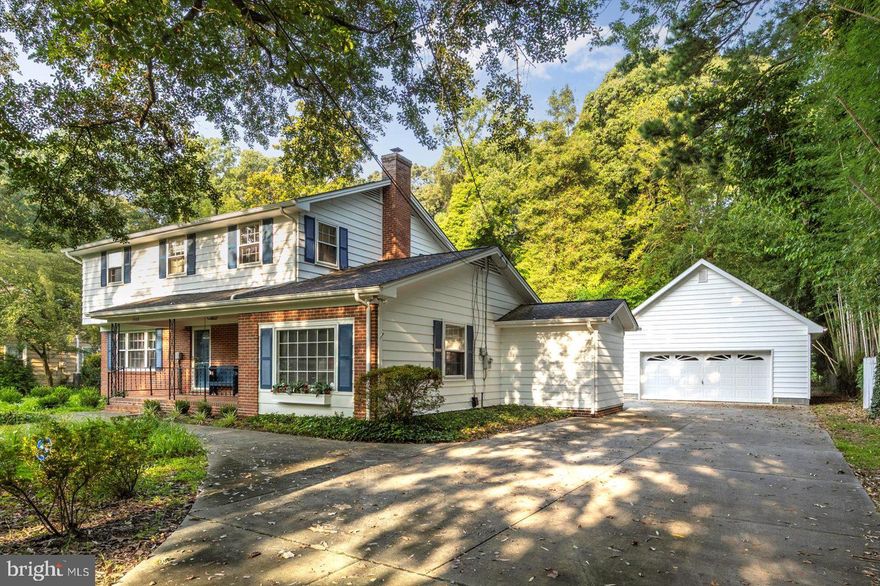 Step into a classic mid-century home where timeless character meets smart, modern upgrades—all on a generous .38-acre lot just outside Salisbury city limits. The property does not pay city taxes, but enjoys the convenience of city water and county sewer—a rare and valuable advantage. Ideally located just minutes from Salisbury University, this home offers peaceful surroundings with easy access to nearby amenities.

Owned by the same family since 1986, the home offers over 2,600 square feet of living space with original hardwood floors throughout. The kitchen was fully remodeled in 2005 and refreshed with painted cabinetry in 2020. It includes a refrigerator, gas range, dishwasher, washer, and dryer—all replaced within the last five years. The home is equipped for year-round comfort with several HVAC upgrades, including a relatively recent downstairs A/C replacement, a new upstairs A/C unit installed in 2023, and a mini-split added to the primary suite in 2024. The oil furnace was replaced in 2014, ensuring efficient and consistent warmth throughout the home via ambient baseboard heating.

A standout feature is the primary suite addition completed in 2021, offering a spacious and private retreat with modern finishes, huge walk-in closet, and independent climate control.

Upstairs, there are four bedrooms, including one with a private ensuite bathroom, providing comfortable accommodations for family and guests. All bathrooms have been tastefully updated, including the upstairs primary bath in 2009, the upstairs hall bath in 2015, and the main-level powder room also in 2015.

The roof was replaced in 2013, and the exterior was freshly painted in 2021. A smooth concrete driveway, added in 2011, leads to a detached two-car garage built in 2001, featuring a roomy attic for additional storage.

The yard is beautifully maintained and equipped with a sprinkler system that was fully refurbished in 2020, keeping the landscaping lush with minimal effort.

Combining original character, well-planned updates, generous indoor and outdoor living space, and city services without city taxes, this property offers a rare opportunity in a sought-after neighborhood. It has been carefully cared for and is ready to welcome its next owner. Will it be you? Call today to schedule a showing!