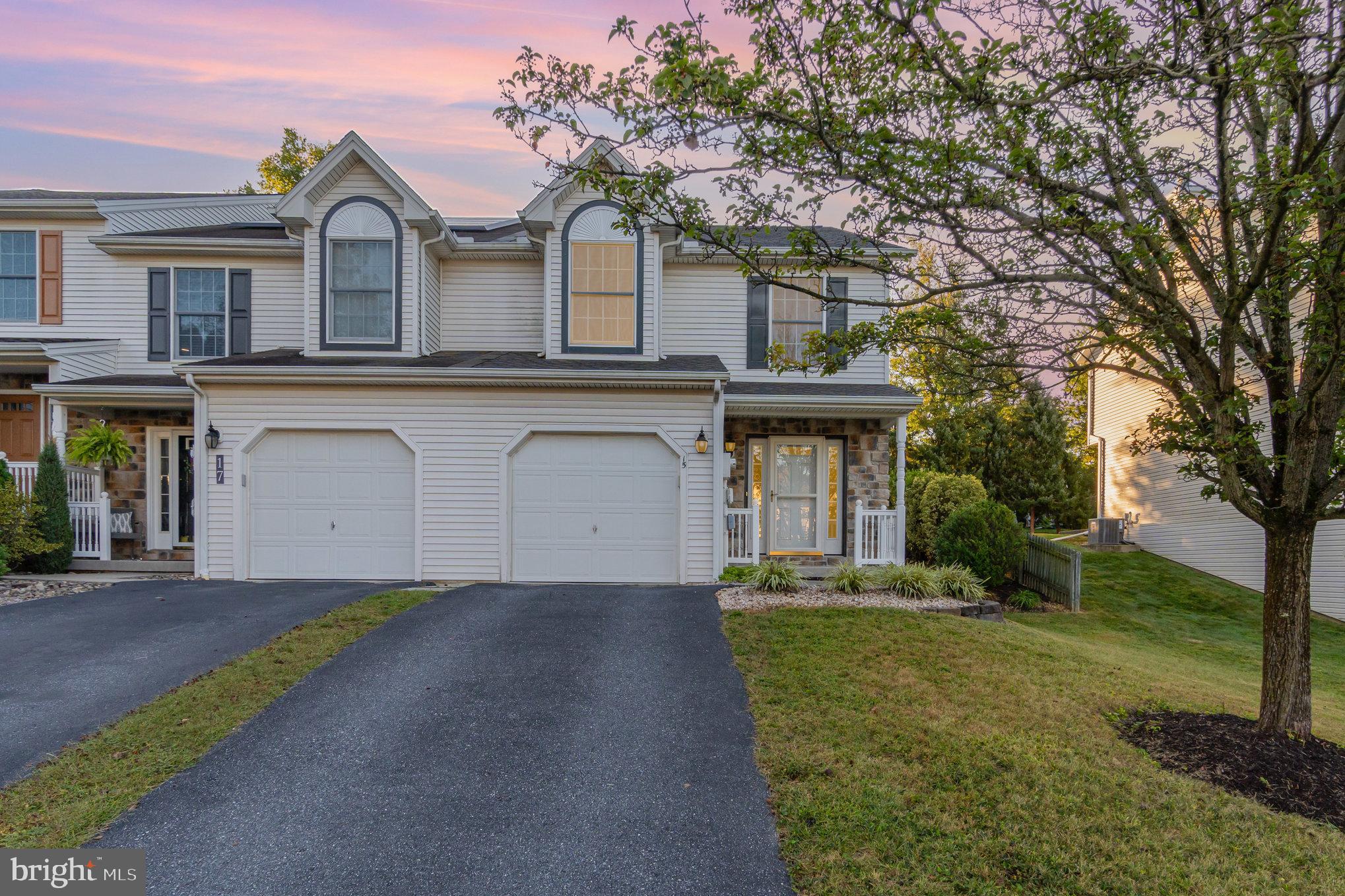 Step inside and fall in love with the fresh updates throughout - newly installed luxury vinyl flooring, freshly painted walls, and brand-new carpet upstairs. This home is filled with natural light and charm, featuring an open living and dining area with sliders that highlight the beauty of the backyard. The spacious kitchen comes equipped with upgraded appliances including the gas stove, microwave, and refrigerator. Upstairs, the primary suite offers a large walk-in closet and full bath, joined by two additional bedrooms and the convenience of second-floor laundry. Out back, relax on the lovingly landscaped patio that provides , near-total privacy (a rare find). The 21' x 40' lower level is a blank canvas, ready to be finished to suit your needs. With a one-car garage, end unit , gas heat and central air no HOA fees, and a prime Mechanicsburg location, this one is a winner!