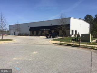large Industrial Warehouse with 2,500 Sq. Ft. of office space, some retail space and showroom. Over 30 foot ceilings in the warehouse. Loading includes 2 Overhead drive-in bays and 1 covered loading dock.
