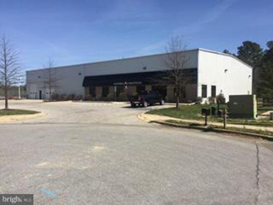 large Industrial Warehouse with 2,500 Sq. Ft. of office space, some retail space and showroom.  Over 30 foot ceilings in the warehouse. Loading includes 2 Overhead drive-in bays and 1 covered loading dock.