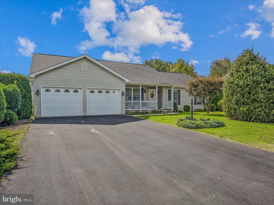 This 3 bedroom, 2 bath rancher is situated in the much sought after Spring Mills neighborhood. This home has been beautifully maintained. You have a large driveway for lots of off-street parking. You have a nice front porch, ready for rocking chairs or a swing. Inside you have a bright, welcoming foyer with overhead light. Hardwood floors continue throughout the home. You have a spacious living room with large windows and overhead light. It is open to your kitchen and dining room. This is a great set up for entertaining! The dining room features a decorative light fixture to define the space. The kitchen features Cherry raised panel cabinetry with Corian countertops. The large island provides extra prep and storage space. The kitchen opens into your large family room with recessed lights. Here you have a lovely fireplace to keep you cozy in the coming winter months. A laundry closet keeps your machines tucked out of view. Down the hall you have two generously sized bedrooms with large windows and ample closet space. The hall bath features a single bowl vanity with oak base and 5 ft acrylic tub/shower. The primary suite features hardwood floors and a large walk-in closet. The private ensuite features a double bowl vanity, soaking tub, and walk-in shower. This lovely interior is topped off with a beautiful sunroom to take in the view. A ceiling fan keeps it nice and airy in the warmer months. Outside you have a large, level, lush lot with manicured landscaping.  This home has everything you want where you want to be. Schedule your showing now!