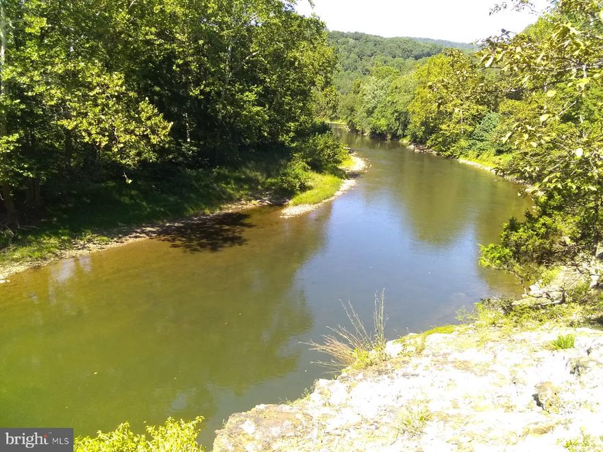 8.7 acres with Cacapon River Frontage, this is a level lot, with smaller trees and  500' frontage on the river just across the lane. An excellent building lot with mountain views. State maintained road to the property providing good year round access. Also has a community river access lot near by.