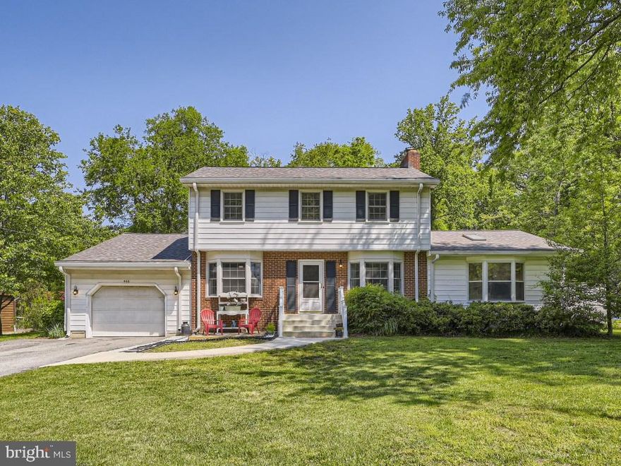 Beautiful, spacious colonial in North Shore, a water privileged community. Live every day on vacation in this well-appointed home with gorgeous hardwood floors throughout. With 5 bedrooms on the upper level there is space for everyone plus an office/exercise room. The main level features two large entertainment zones, a full bath, kitchen with table space, separate dining room, and a great room with a vaulted ceiling. Additional finished space in the basement is ideal for hobbyists or for additional storage. The large, level yard is perfect for entertaining and admiring the well-planned gardens with yearlong interest. Steps from the home are the community amenities, including a beach, waterfront pavilion, boat ramp, marina, tot lot and park area. Year-round activities are included in the voluntary HOA.