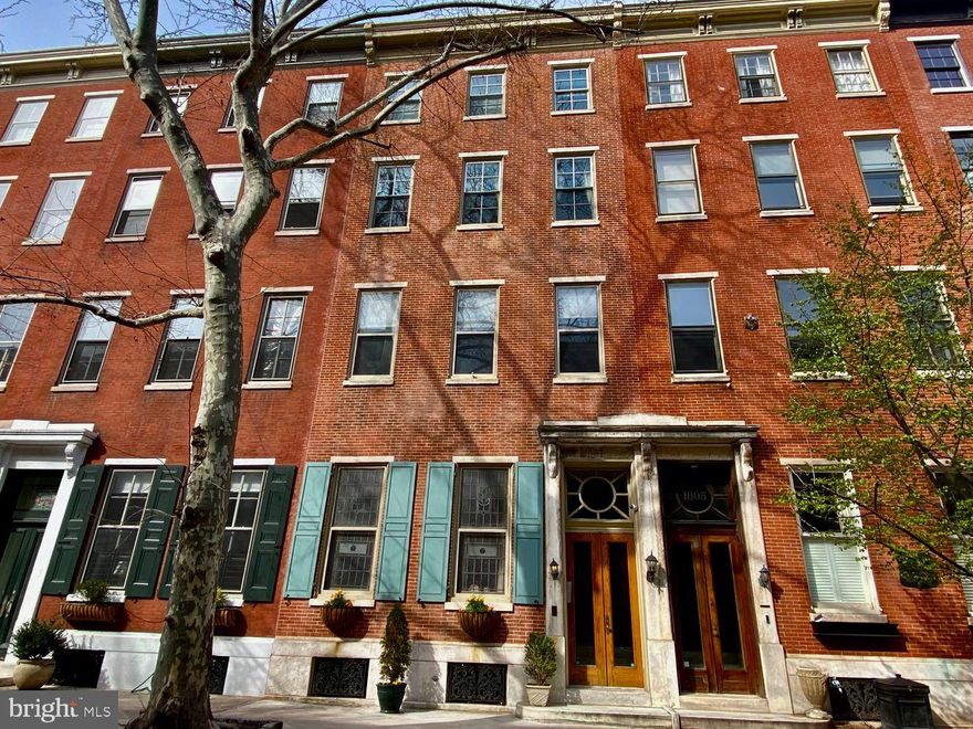 This stately residence seamlessly blends old-world charm with luxury and is located in the highly prestigious Rittenhouse Square. From its rich hardwood floors, 10-foot ceilings, and original architectural details, to the spectacular view from the sizable rooftop deck of Center City, this home is breathtaking. This residence is currently a four-unit property with the option to be converted back to a single-family townhome.

Enter the residence into the foyer, leading to the lavish living room/office space. The main level flows seamlessly, providing an excellent layout for office use or personal entertaining. You will be amazed by the ample natural light from the enormous windows and the traditional wood-burning brick fireplace adding character to the room. There is an owner's unit on the fourth floor featuring an open floor plan between a beautifully appointed kitchen. This opens to the elegant main living area with fireplace. Also featured is a magnificent primary suite with double closets, and an ensuite master bathroom. The primary bath features a dual vanity, custom tile work, and a glass-enclosed shower with a seating bench. Additionally, this floor showcases another well-sized bedroom complete with double closets, in-unit laundry, and a second bathroom. The second and third floors each have a one-bedroom rental unit with fireplaces. There are a total of four bedrooms, three full baths, and two powder rooms.

You will also have the luxury of an attached one car private garage. Enjoy all that Rittenhouse Square has to offer with its excellent dining, shopping, theaters, museums, and stunning park.