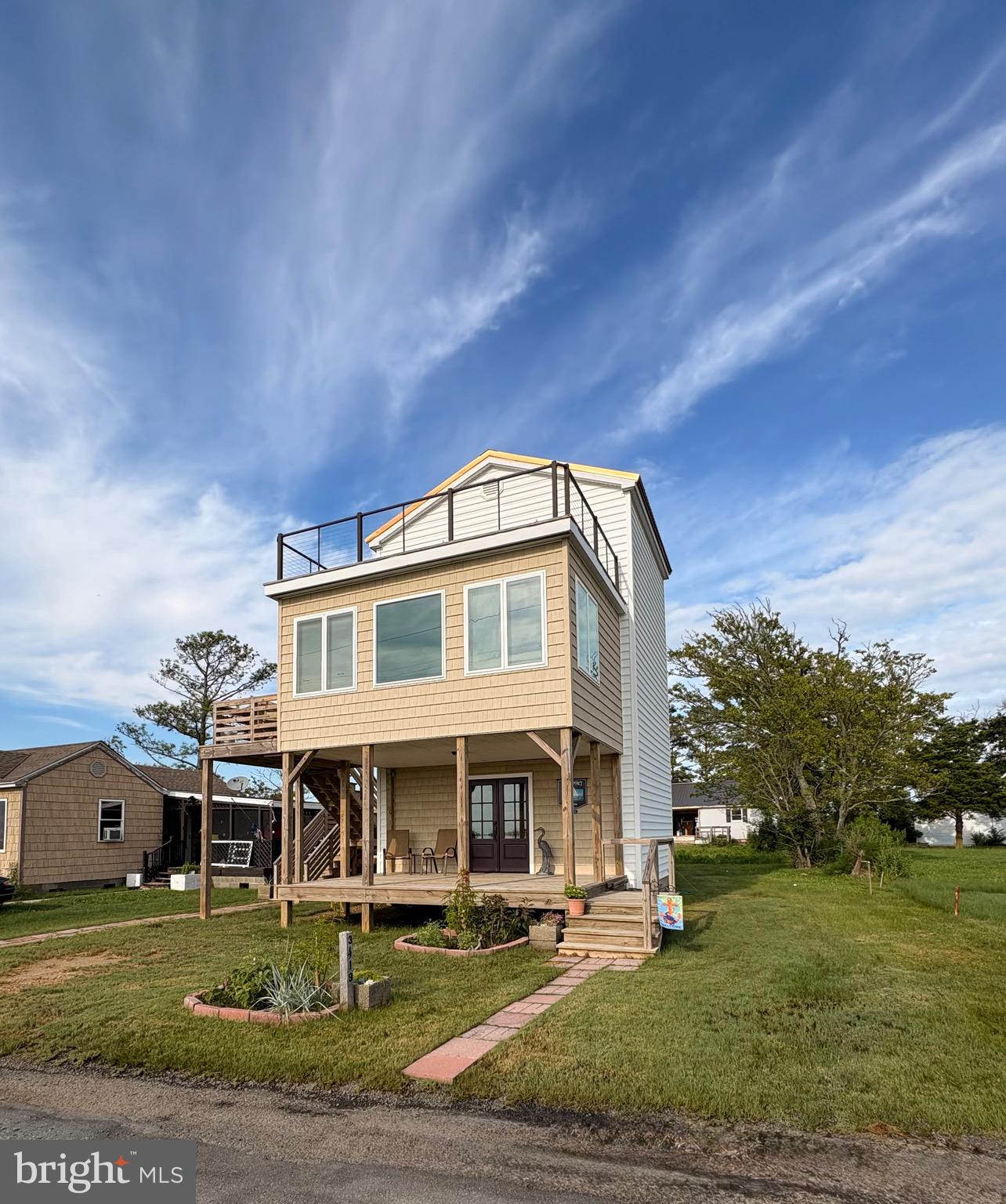 Island living at its best!This beautifully custom-built three-story home offers stunning panoramic views of the Chesapeake Bay. The recently updated two-bedroom, two-bathroom home has a lot to offer. It comes fully furnished with everything you need to move right in. HVAC system is only two years old and serviced every year. The first level bedroom has its own private bathroom and is located on the ground floor with access to the outside covered deck. The middle of the home features the living room and well-equipped kitchen. Make the most of every spectacular sunset from the comfort of the living room adorned with new sectional sofas. Upstairs on the third floor you will find the primary bedroom and bathroom. Step out onto the new spacious deck and take in the breathtaking views of the Chesapeake Bay. Enjoy watching ships navigate up and down the bay. Don’t miss out on this incredible opportunity to own this magnificent property! Contact us today!