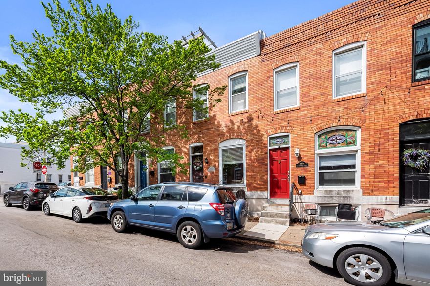 Located in the heart of Canton, one of Baltimore’s most beloved neighborhoods, this 3-bedroom, 2-bath Colonial-style rowhome blends classic charm with a prime location just two blocks from Patterson Park. Hardwood floors run throughout the main and upper levels, creating a warm and inviting atmosphere across the living, dining, and kitchen spaces. The kitchen features maple cabinetry, Formica countertops, and stainless steel appliances, providing a functional layout for everyday living and entertaining. Upstairs, two bedrooms with hardwood floors share a full bath, while the finished lower level includes a third bedroom, a private full bath, and a laundry area—ideal for guests, work-from-home needs, or additional living space. Additional highlights include updated bathrooms, a newer HVAC system installed within the past two years, a rear parking pad, and convenient on-street parking along an easy-to-park block. Enjoy city living just steps from Patterson Park and close to Canton’s shops, restaurants, and waterfront attractions.