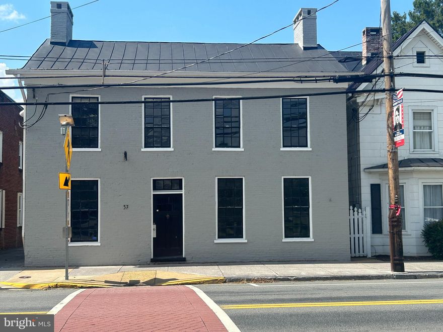 EXTREMELY MOTIVATED SELLER!!  Bring your business to beautiful downtown Berryville!! Situated next to Rose Hill park and the Barns of Rosehill.  Large commercial space with over 3,200 sq ft.  Separate rear entrance for upstairs space that is move-in ready while you have a blank canvas on the lower level  that will allow you to tailor exactly what you business needs may be! Tons of character with so many possibilities.  Partial re-model on lower level, new roof and re-pointing of exterior brick with fresh paint.  Hardwoods with fireplace(s) - ornamental or can be restored , exposed brick, high ceilings and tons of parking both on-street and in rear private lot.  Square footage is approximate.