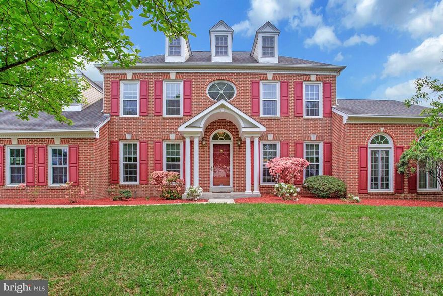 Experience the grandeur of this Stately and Elegant Colonial situated on a quiet corner lot in Bowie's desirable Collington Station Neighborhood. Upon entering the main level, you are welcomed by stunning hardwood floors and upscale chair and crown molding, leading to a spacious family room complete with a cozy wood-burning fireplace, perfect for chilly evenings indoors. The gourmet kitchen, filled with natural light from the expansive bay window, boasts stainless steel appliances, including a gas range, ample cabinetry, a pantry for storage, and a built-in writing desk. The upper level features a magnificent primary suite with soaring vaulted ceilings, two walk-in closets, and a generous ensuite bathroom equipped with a dual vanity, skylights, a tub, and a glass-enclosed shower. The oversized unfinished basement awaits your personal touch and already includes a rough-in for a full bath. Conveniently located just minutes from shopping, restaurants, entertainment, and major highways, this home is a commuter's dream. Don’t miss out on this exceptional opportunity—act quickly, as this one won’t last long!