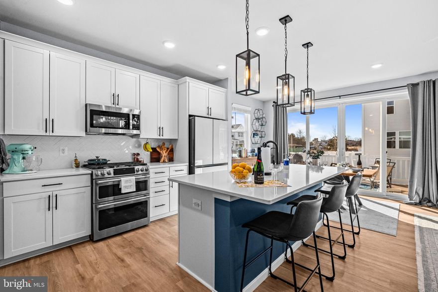 Immaculate one year old home full of owner upgrades!  This home in the Foxhaven community has all the bells and whistles.
Enjoy the clean look of white kitchen cabinets with custom pull out drawers, white quartz counters and beautiful white herringbone pattern tile backsplash.  Owner newly upgraded Stainless steel appliances including a Cafe Elect duel fuel range (seller installed a buried 150 gallon propane tank for gas cooking), a Fisher & Paykel drawer dishwasher and the trendy Samsung Bespoke counter depth Glass front French door refrigerator with dual filtered water dispersal. A whole house water softener and reverse osmosis kitchen filter offer top of the line water quality. All three finished levels  boast a durable yet attractive warm honey colored luxury vinyl, including both staircases, that goes with any style and decor. Upstairs you'll find a generous sized primary bedroom suite with an attractively decorated private bath, plus a hall bath for the two large secondary bedrooms.  Relax in privacy in the upper loft or use  for an office or homework area away from the hustle and bustle of the kitchen. Laundry room conveniently located on bedroom level with new front load washer and dryer.  The fully finished basement offers a rec room area, storage and a 4th bedroom with a beautiful tiled full bathroom. 

Step outside onto the maintenance free composite deck to enjoy a large yard fully fenced with attractive and also maintenance free vinyl fencing. * Other convenient upgrades include Vivint smart security system including 3 exterior and one interior cameras * Energy efficient one-way UV protected windows throughout, allowing you to see outside, but stops others from seeing in during the day * Second electrical panel added for finished basement * White window blinds throughout * Gladiator storage and 220v EV in garage * fresh paint throughout * Attractive ceiling fans in all bedrooms and family room 

Simply move in and enjoy!