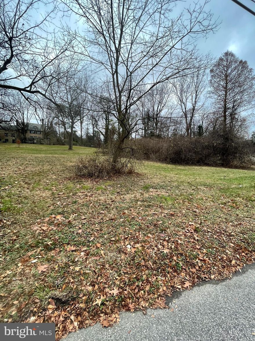 Located in desirable Chestnut Hill, this lot is situated in a gorgeous park-like setting overlooking the renowned Morris Arboretum. The surrounding property is a truly special oasis, complete with lush trees and foliage. You will find both serenity and convenience in this stunning locale, with the top-quality shops and restaurants of Germantown Avenue just minutes away.  This lot is located on the section of Hillcrest Avenue that can tie into the public sewer, no private septic is needed.