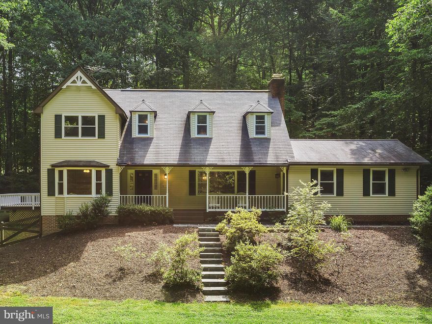 If you are looking for privacy, for nature watching at its finest or a place to put a terrific vegetable garden, our home is it. Our sun drenched home has a beautiful front porch overlooking 5 lush acres - loads of trees and amazing privacy  but close to everything - restaurants, grocery stores. Enjoy seeing the wildlife from your front porch. We offers newly finished hardwood floors(19) on the main level, newly painted interior(19), updated kitchen with natural cherry shaker cabinets, Corian countertops, New French door stainless steel bottom drawer refrigerator(19), ceramic top stove, two pantry cabinets with roll out shelves, a utility cabinet, recessed lights, new kitchen flooring(19), a skylight and a stainless Corian double sink with a window overlooking the back yard. The family room is off the kitchen with hardwood floors, vaulted ceilings with a skylight, a walk in bay window overlooking the back yard and a sliding glass door to the deck - perfect place for family gatherings and enjoying summer BBQs. On this level, we have a large mud room with a laundry sink, a living room with a wood burning fireplace and a spacious separate dining room. We offer a main level bedroom with a ceiling fan and a full bath - hard to find in this market, an office with built in book shelves and great views of the front yard - very private. The upper level has our master bedroom with a walk in closet, dormer accent windows, a master bath with a newer white cabinetry and  a separate shower room. There are two additional bedrooms on this level ( one with ceiling fan) and a hallway full bath. The upstairs foyer has a game closet. The walk out lower level is finished with a recreation room, a 1/2 bath and a large storage room. Our home has 3 AC Systems for cooling and heat. Our home has been fenced around the house but expands much farther - see survey in documents. Convenient location to 123, Fairfax County Parkway and loads of parks with nature and bike trails. Additional updates include: exterior siding(19), interior freshly custom painted(19), new kitchen laminate flooring(19), refinished hardwood floors(19), and new toilets(19)