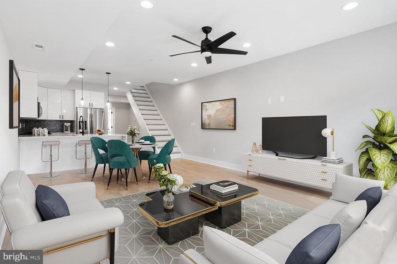 Welcome to Passyunk Place, a collection of vibrant new construction condos located in the heart of Passyunk Square. This bi-level unit features an open floor plan with an abundance of natural light. Inside, you'll find wide-plank hardwood floors, custom kitchen cabinetry, quartz countertops, recessed lighting, a home entertainment package, and a Ring doorbell for added security. The main floor includes a spacious living area, a modern kitchen, a full bathroom, and a bedroom. The second floor boasts two generously sized bedrooms, each with its own bath. And to top it off, there's a private roof deck offering stunning views of the city. Located just steps from local restaurants, shops, and parks, this is a highly walkable neighborhood that offers the best of urban living.