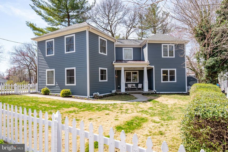 Check out this lovely 4 bedroom plus office, 3.5 bath single-family home in Del Ray. The home was rebuilt/reimagined in 2016 with a contemporary/craftsman vibe, open plan and unique flow with separated wings for easy living. The main level living area is open, with 9’ ceilings and wide plank hardwood floors.  The kitchen has white cabinets, a granite center island, stainless appliances, pantry, and a door to the back patio.  To one side of the kitchen is the dining room, to the other side is the bright and spacious living room. Offset from the main living area is a bedroom, office (that could serve as a 5th bedroom), stylish full bath, and a mud room with WiFi-enabled combo lock to the side door.  At the top of the lovely custom oak staircase is a roof deck that looks out over the Mount Jefferson Park Greenway. At the front of the house on this second level is a generous primary suite with a walk-in closet, additional closet, and a full bath with glass walk-in shower.  Down a hall past the laundry, you’ll find two bedrooms and a shared hall bath with tub shower. The lower level is the footprint of the original house, with a carpeted rec room, powder room, and utility/storage room. Useful extra storage in the crawl space under the dining room. Note that the floor plan measurements reflect 3302 total SQFT (1423 Main Level, 1256 Upper Level, 623 Lower Level), more than is reflected in the tax record. Custom finishings that make the home quite special and unique include oversize crown molding, baseboards, and designer baths. For ease and comfort, both HVAC zones have smart (Nest) thermostats. The front yard is fully fenced with a flagstone porch on which to chill out while Fido romps around.  The lot extends to the end of the patio in back, where the public  greenway beyond gives the illusion of a more expansive yard! Off to the side is a large shed to store all your outdoor “stuff,” and the parking pad accommodates 6 smaller or 4 larger vehicles. The new Potomac Yards metro stop is about a half mile walk; and a playground, dog park and the heart of “The Avenue” is a short stroll away. So many things to love!