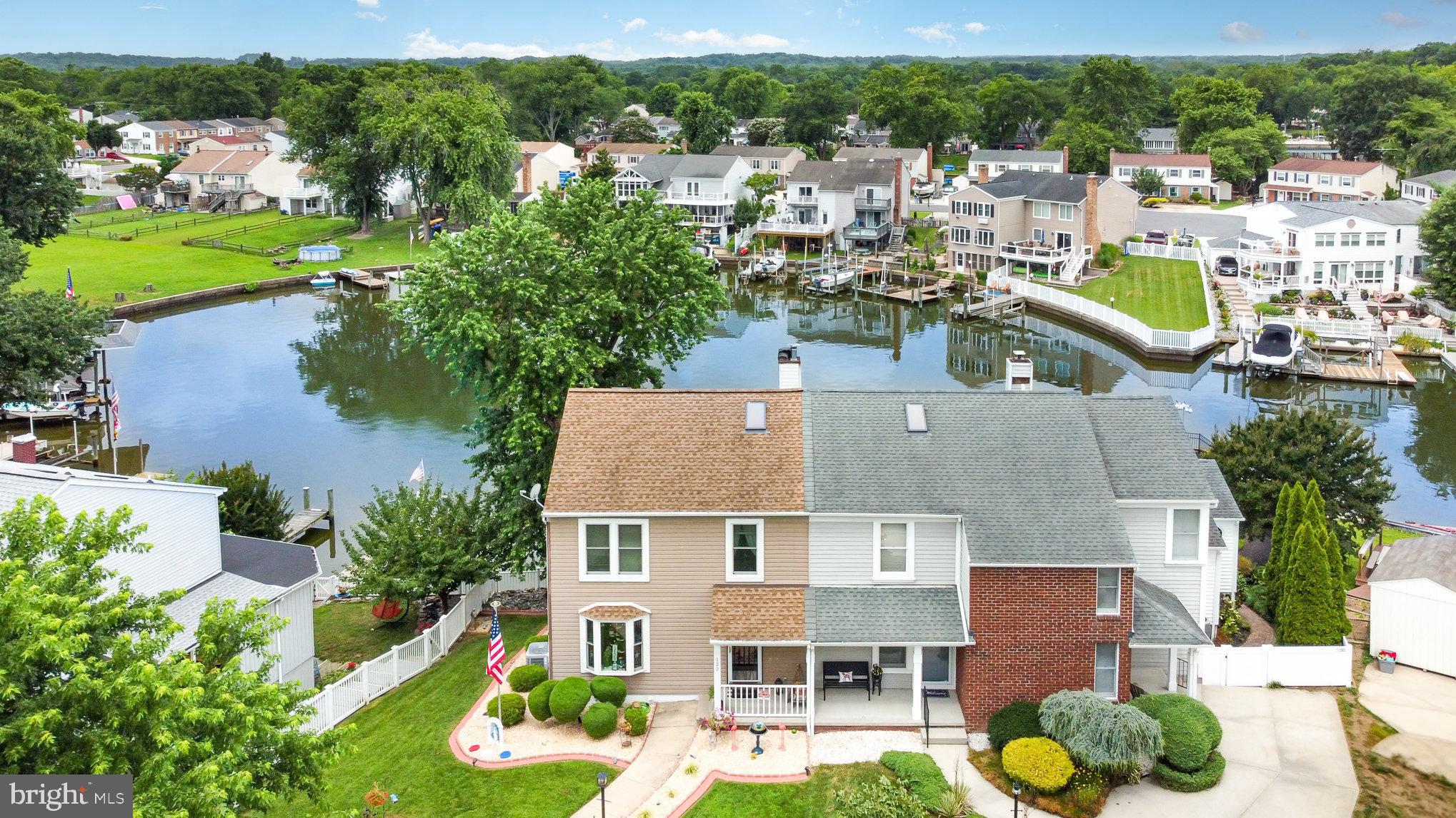 Price Improvement!!! Don't wait and miss this Waterfront Home. Nestled in the serene enclave of Rumsey Island, this residence offers a harmonious blend of contemporary design and waterfront living. This Custom Built home in 1985 is meticulously maintained and updated. The home spans an impressive 3,330 square feet, showcasing a thoughtful layout that caters to both relaxation and entertainment. Step inside to discover a warm and inviting interior adorned with rich hardwood flooring and ceramic tile. The spacious great room area features a slate fireplace w/pellet stove insert & mantel, with built in bookcase creating a cozy ambiance perfect for gatherings. The kitchen, equipped with stainless steel appliances and upgraded granite countertops provide ample space for culinary creations, the breakfast bar & adjacent eating area invites casual dining with views of the lush & waterfront surroundings. The main floor laundry & mud room area off of the side porch & kitchen adds convenience. The thoughtfully designed primary suite boasts a slider to private balcony, walk in closet and luxurious bathroom complete with a soaking tub, ensuring a private retreat for relaxation. The hard to find basement with family room has apellet stove and a french door to access the back yard. Additionally in the walkout basement is a den, storage/utility room and several storage closets. Outside, the property is equally captivating. The exterior features a charming front porch and side porch for easy access enhancing the curb appeal, while the fenced landscaped lot, situated on a peaceful cul-de-sac, offers a sense of privacy and tranquility overlooking the water along with back deck & awning. The 0.15-acre lot is bulkheaded and provides direct access to the stunning Gunpowder River, making it a water lover's paradise. Enjoy your own private dock site, complete with a boat lift and multiple slips, perfect for boating, kayaking, or simply soaking in the picturesque water views. The outdoor spaces are designed for enjoyment, featuring a spacious deck w/retractable electric awning and balcony that overlook the canal, ideal for entertaining or unwinding with a book. The property’s waterfront location ensures that every day feels like a vacation, with the soothing sounds of water and the beauty of nature at your doorstep. This home is not just a residence; it’s a lifestyle. With its blend of luxurious interior features, stunning exterior spaces, and unparalleled access to water activities, this property is a rare find that promises to meet the needs of discerning buyers seeking both comfort and adventure. Experience the perfect balance of elegance and leisure in this remarkable Rumsey Island retreat. Mariner Point Park and the newly revitalized North Bay Marina with Tiki Bar, Dining, Pool, Fuel Service and more is located right in the heart of Joppatowne on the Gunpowder River. Make sure to see the Virtual Tour & 3D Tour.