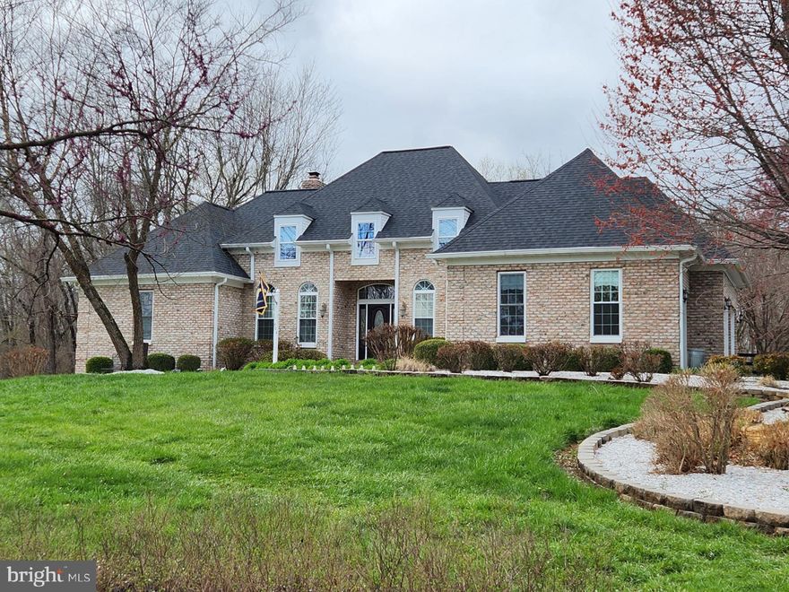 This all brick rancher has been very well maintained by its original owners who spared no expense when they had it built and offers massive amounts of space.   The owner's suite has an inviting propane fireplace, walk in closet, cozy sitting room with a view of the backyard, built in bookcases and access to the recently painted deck.  The primary bathroom has double sinks, jetted soaking tub, shower stall and another walk in closet.  The 2  roomy secondary bedrooms both have ceiling fans and share a Jack and Jill bathroom.  The kitchen has quartz counter tops, cooktop island, double wall oven, fridge with ice maker, pantry, breakfast bar, room for a table and access to the deck.  The living room has a very warm wood burning stone fireplace with a 3rd access point to the deck.  The basement has two areas for entertaining, the first has a bar that conveys and a large rec room that was used as a media room.  There is also another full bathroom,  a hobby room and a sizeable unfinished portion that would be great for storage.  The backyard is fully fenced and has wire on the inside to keep small pets in the yard.  There is a laundry room on the main level and additional hookups in the basement.  The efficient Insta Hot water system will get the hot water where you need it right away.  Architectural Shingles and gutters (with gutter guards) were replaced in 2018.   3 car garage has two bays that are 22 feet deep and the other one is 19 feet deep.  This fantastic house will be available for showings on the 12th of April.