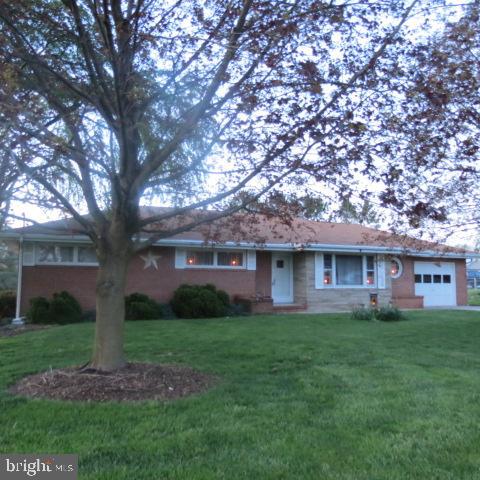 This all brick rancher on .58 acres lot could be your home! Spacious bright living room with brick fireplace (stove insert). Kitchen with plenty of cabinets. Large dining room with sliding doors that leads to deck with nice rear yard that backs to fields. Wood floors through out. Basement that could be living area and plenty of storage. Being sold "AS IS"
