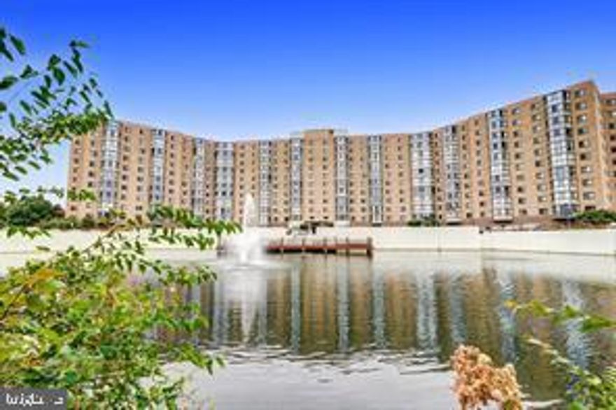 Spacious and inviting G Model featuring an owner's suite with a walk-in closet, additional closet, dressing area, and private bath. The second bedroom, located on the opposite side of the unit for added privacy, offers a generous closet. The bright eat-in kitchen boasts white cabinetry and newer appliances, flowing into a dining area and a large living room that opens to a sunroom. Freshly painted and move-in ready, this home also includes a sizable storage closet off the foyer with a hardwood entryway.

Experience the vibrant lifestyle of this thriving active senior community, offering exceptional amenities: golf course, indoor and outdoor pools, pickleball and tennis courts, two clubhouses, a theater, an on-site medical center, and a variety of clubs and organizations. Enjoy the convenience of free transportation within the community and to nearby shopping centers, plus a Metrobus stop at the clubhouse providing access to the Glenmont Metro. Ideally located near shopping, dining, and social activities—this is a home you won’t want to miss!

Includes your own covered parking space #5-136.