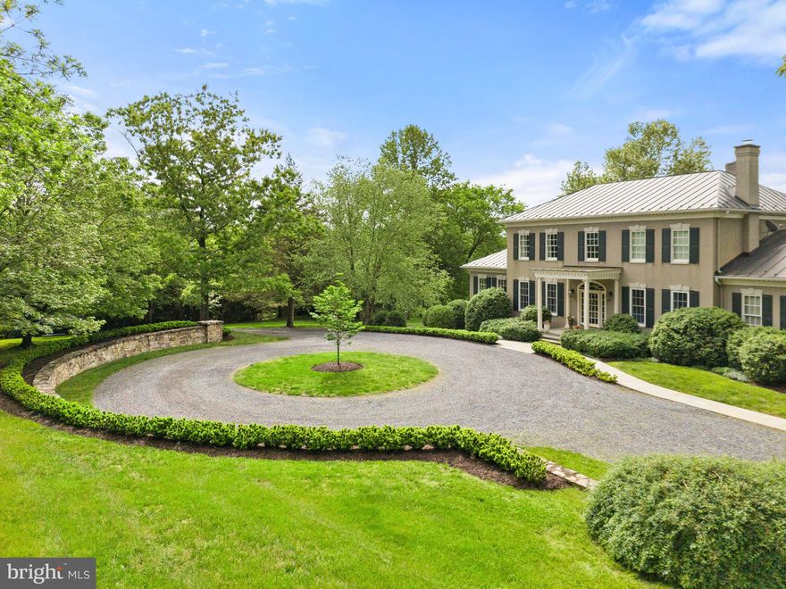 Welcome to this elegant Georgian manor home on twenty plus landscaped acres with Goose Creek frontage and mountain views in Middleburg.  The thoughtful floor plan is perfect for entertaining and family living. The 8,000 + square feet cover 3 levels and showcase quality finishes and architectural details. There are four bedrooms (two primary suites, one on the main level) all with en suite bathrooms and large closets.  The main level primary suite includes a large walk in closet with built ins and large bathroom offering dual sink vanities with marble countertops, separate soaking tub and large shower. The marble floors are heated. 
The main level of the home is open and airy with large windows and doors throughout to take in the garden views. The main level includes a formal living and dining room; home office with built in bookcases; gourmet kitchen with Sub zero and Wolf appliances; breakfast nook and walk in pantry; there are two family rooms both with fireplaces and tv room/ bar with built in refrigerator and wet bar. A large laundry room with built in storage is off of the kitchen.  
The lower level offers an abundance of space and a multitude of options for your living needs and personal style. There is a full gym with rubber flooring, a conditioned wine closet, a full bathroom, mechanical room and three large carpeted rooms for your specific use. There is abundant storage on this level. The attached two car garage is accessed here and includes a separate stairway from inside of the garage up to the laundry room next to the kitchen. The garage has a separate mechanical room and more built in storage. 
Mature landscaping and large trees enhance the home. There are multi-level formal gardens with specimen crepe myrtle trees, raised garden beds and multiple seating areas for entertaining and enjoying the out of doors. 
A large pasture is at the back of the home and offers ample space for horses or other livestock. A run in shed and large equipment building are available. The property is in Middleburg Hunt territory. The pasture is surrounded by woods and bordered by Goose Creek.  The adjacent landing to Goose Creek offers easy access to launch your kayak or just sit and fish. 
This quality property is truly one of a kind and is not to be missed.