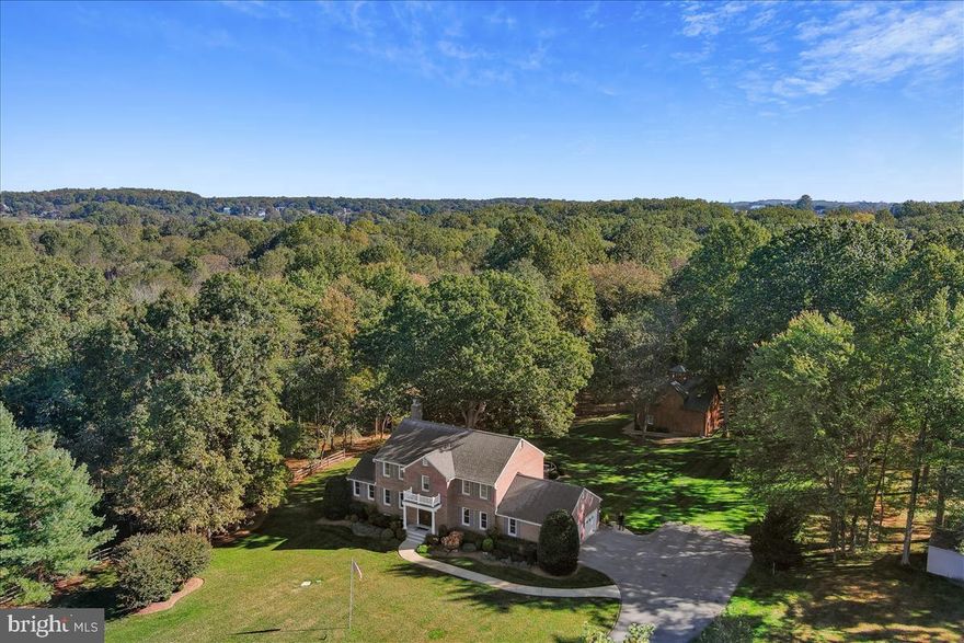 Welcome to the home you’ve been waiting for! This exceptional custom-built all-brick colonial boasts 5 spacious bedrooms and 4 luxurious bathrooms, offering over 4,837 square feet of meticulously crafted living space. Set on nearly 3 acres of lush land and bordered by the serene beauty of Rock Creek Park, this stunning Rockville residence has been thoughtfully updated and impeccably maintained.

Recent upgrades include fresh interior paint, refinished hardwood floors, and a new roof installed in 2021, brand new 75 gallon water heater Aug 2024, ensuring that this home is as modern as it is timeless. Upon entry, you’ll be greeted by a grand two-story foyer that sets the tone for the rest of the home. The gourmet kitchen features exquisite granite counters and a stylish backsplash, while the first-floor office provides a private and productive space. The fully finished walk-out basement offers endless possibilities for recreation or relaxation, complete with a cozy gas fireplace and woodstove.

Luxurious details abound, including his-and-her walk-in closets, a Kohler house generator for peace of mind, dual 200-amp electrical panels, and energy-efficient geothermal heating and cooling. The exterior is equally impressive, with a synthetic deck, a charming gazebo, and a convenient chandelier lift system. Enjoy ultimate comfort with heated bathroom floors, a dedicated animal wash station, and an underground dog fence. Plus, built-in speakers provide the perfect soundtrack to your daily life.

Step outside to your own private oasis. The meticulously manicured backyard is ideal for outdoor play, entertainment, or simply relaxing in a park-like setting. The possibilities are endless with the custom 1,700 square-foot, two-level oak barn, complete with two animal stalls and power, offering countless opportunities for use. The yard also provides direct access to walking and biking paths within Rock Creek Park, connecting you to the natural beauty of the area.

With easy access to the ICC and Metro, this home truly offers the best of both worlds—seclusion and convenience. This is a rare opportunity to own a masterpiece of design and function. Don't miss your chance to call this magnificent property your own.

To the public— Please do not show up unannounced without scheduling an appointment. Home is occupied by the owners.