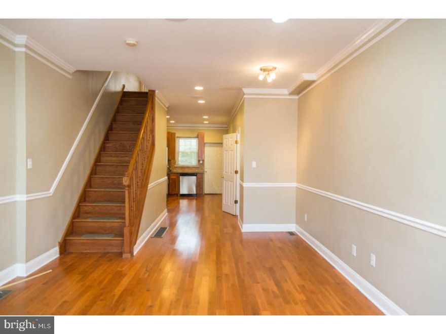 This gorgeous Point Breeze home is available for an early July move-in. Just recently updated, this 2-story single family home is complete with hardwood floors, beautiful granite and tiling, stainless steel appliances, plush wall-to-wall carpeting upstairs, and a private outdoor space out back. Enter into the large family room, and the open floor plan leads right back to the kitchen and patio door. You'll love the open, yet cozy feel that this space offers. The kitchen is brightly lit, and features warm toned wooden cabinetry complimented by the granite countertops, and stainless steel appliances. There's also a half bath branching out from the kitchen, for added convenience. Downstairs, the large finished basement offers lots of clean storage, and could also be a comfortable media or playroom. The laundry room is also in the basement, with full size washer and dryer installed. Upstairs, the main hallway stretches between the two huge bedrooms (one with walk-in-closet), with the updated bathroom between them. Each bedroom has plush, clean carpeting and large windows for lots of natural light. First month, last month, one month security deposit due at lease signing. $45 application fee per applicant. Pets are conditional on owner's approval and may require an additional deposit, if accepted. (Generally $500/dog and $250/cat). Tenants responsible for all utilities: water, gas electricity, cable/internet.