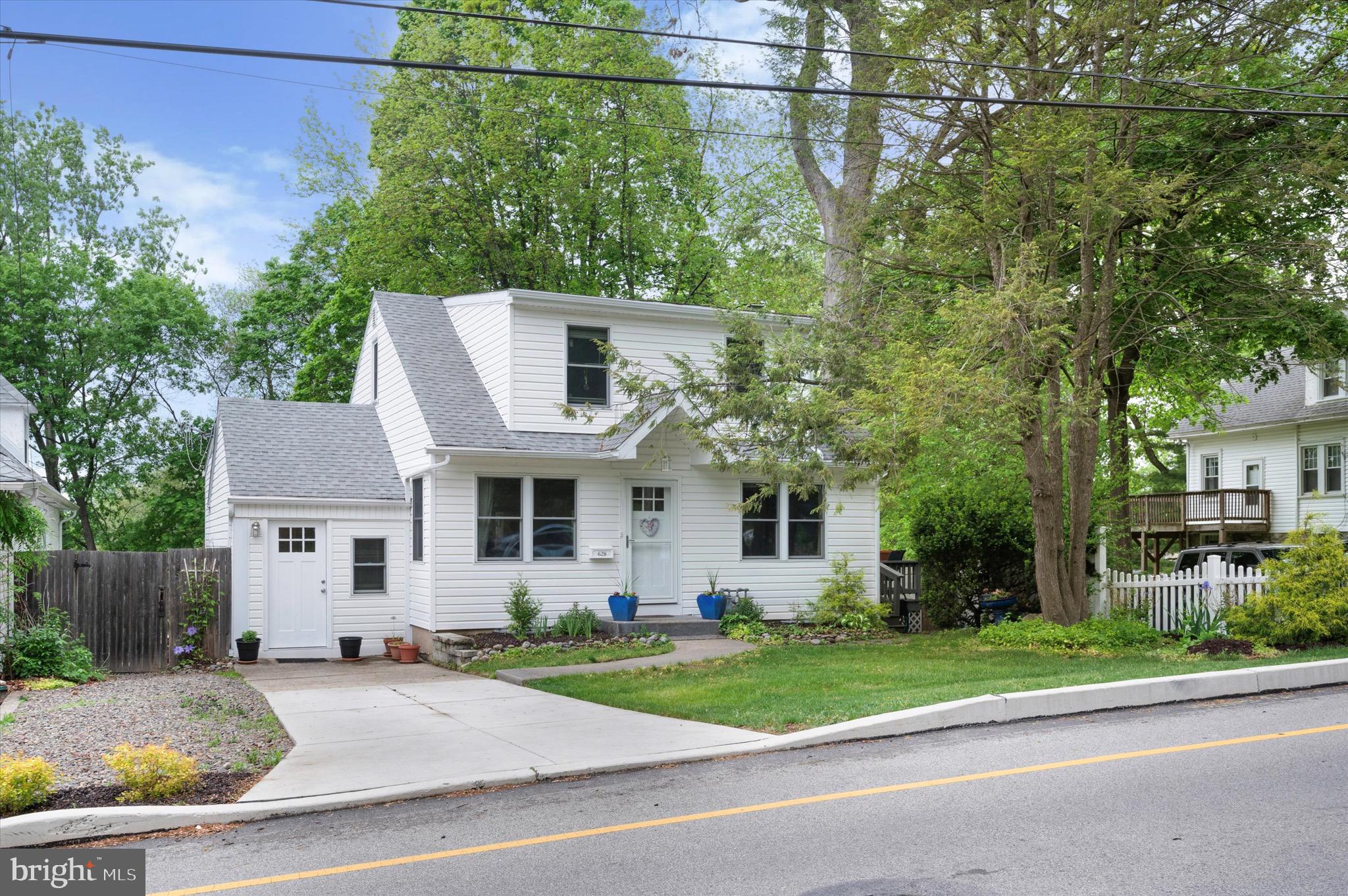 This lovely cape cod has been fully renovated and offers the best of the old and new. It's an adorable cottage style cape cod set on a deep, private lot on the newly redeveloped section of Edge Hill Road. The original wood floors have been stained a deep brown color and run through the entire main living area. The open kitchen, living, dining room offers great flow and an updated kitchen that even the most serious cooks will be thrilled with. A large pantry with baker's racks that remain with the property, and laundry room combined on this level offers so much convenience. The newer washer and dryer remain with the property. Two bedrooms are found on the main level, one of them with its own private entrance. An updated full bath completes this level which has neutral paint colors, newer windows, newer French doors lead out to a lovely deck off the main living area that overlooks the deep lot with lush plantings, a pergola and a bench swing with a child's swing giving you a place to both soak in the sun and entertain outdoors. There is a second deck off the side of the house that is private, shaded and can offer a serene escape. The second floor has two bedrooms, one with newly installed carpet and an adorable, updated bath. Use of space is phenomenal and for a house of this age, the closet space is fantastic. This level has a mini split system for AC.
A full basement with a new set of steps and three new slider windows with screens offers a clean, painted space with great ceiling height. ready for finishing or storage or a workspace.
With new wiring, LED lights throughout, many on dimmer switches, a newer roof, newer Pella windows plus new exterior doors and a newer HVAC, everything has been thoughtfully updated leaving a new buyer with a low maintenance home where you can drop your bags and kick up your feet. A 2 car driveway completes the exterior offerings.
Equipped with modern amenities, the property features gas heat, forced air, central air conditioning, and a mini split system to ensure year-round comfort. The exterior showcases a classic design that complements the neighborhood's charm, offering both curb appeal and a sense of tranquility.
Whether you're unwinding on either one of the two decks or enjoying the cozy indoor spaces, this home provides a delightful living experience. Don’t miss the opportunity to make this house your home, where comfort and convenience come together in a sought-after location. Schedule your private tour today and envision the possibilities that await in this Glenside gem!
**Square Footage is an estimate and should be verified by buyer