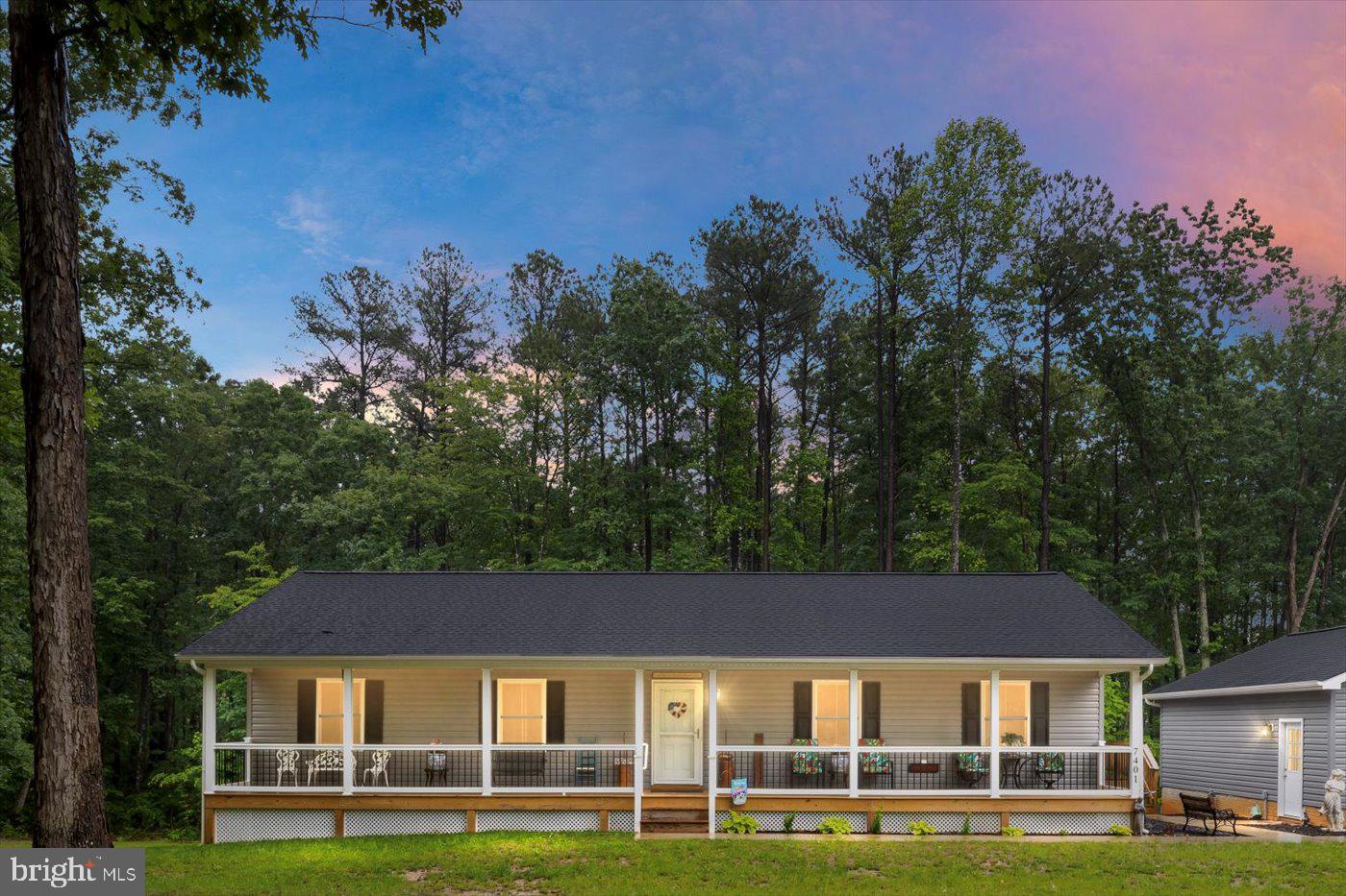 Absolutely beautiful ranch-style home on a full basement that is partially finished. Home boasts a full front porch for sitting in those rocking chairs with evening coffee. Also has a nice side deck with a connecting walkway to the large 2-car detached garage, double doors with 2 openers. The property consists of 5+ acres (good for horses) and has long road frontage. Need parking for extra vehicles? There is a HUGE 3-car-wide gravel area to park that RV or extra work trucks. Inside is stunning with a cathedral ceiling in the large living and dining area .... seller has added beautiful crown molding. Open area flows into the beautiful kitchen with white cabinets, an island, granite countertops, stainless appliances, with laminate plank flooring. 3 nice-sized bedrooms, primary bath, and hall bath finish the upstairs. The basement has a large family room and a full bath. This 3-year-old beauty was built by top-quality builder Spotsylvania Construction Inc Want to be CLOSE to Lake Anna? The State Park is right around the corner ... so bring that boat.