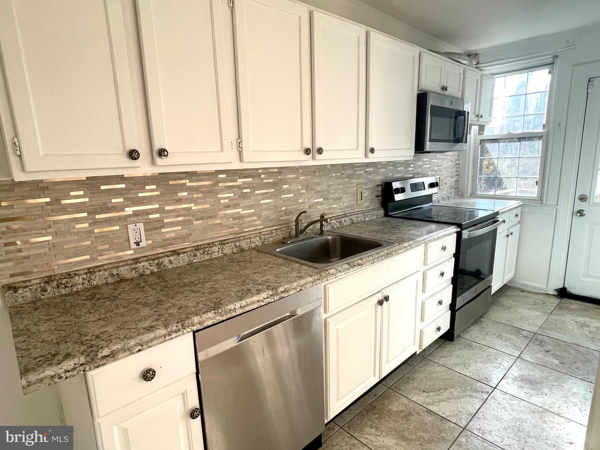Qualifies for $5,000 Grant from Chase Homebuyer program! Terms apply. Discover this well-maintained, owner-occupied townhouse located in a highly convenient neighborhood, just off Marshall Road. Only a block from the 42 bus stop with direct routes to the University of Pennsylvania and minutes from the 69th Street Terminal, this home offers easy access to all that Philadelphia has to offer. Philadelphia International Airport is just 20 minutes away, and University City is a quick 15-minute drive. The motto for Upper Darby, Pennsylvania is “The World in One Place”.
Upon entry, you'll find a spacious living room that flows into a bright dining area and an open kitchen—a perfect setup for entertaining. A convenient powder room is located just off the kitchen, and from here, you can step out to a lovely deck, ideal for summer BBQs and outdoor relaxation.
The second floor offers a comfortable layout with a generous primary bedroom featuring ample closet space, a second bedroom, a cozy reading nook, and a hallway bathroom. Additional highlights include two-car parking at the rear, a welcoming front yard perfect for gardening, and close proximity to schools, shopping centers, and grocery stores.
20 minutes to Philadelphia! Brand New painted walls, gleaming hardwood floors, and a main bathroom featuring a spacious skylight. Brand New heating system with Manufacturer Warranty from New Yorker boilers. Attached 2-Car garage. - This charming home won’t last long!