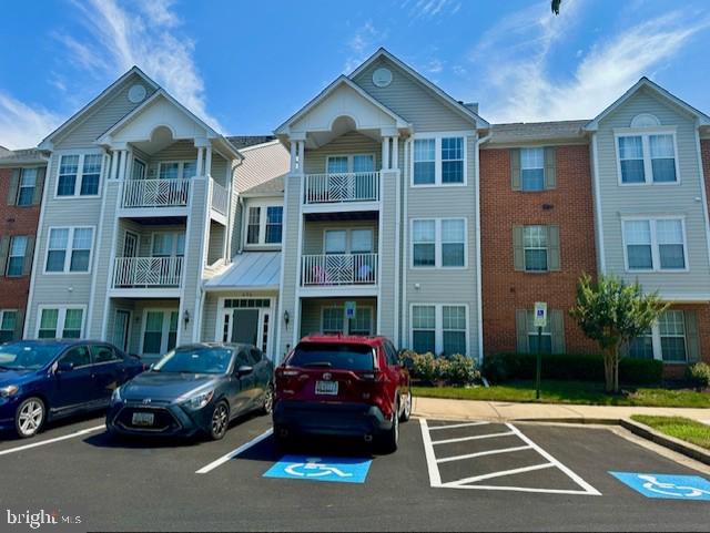 Great ground level 2-bedroom, one bath handicap accessible condo in the heart of Piney Orchard community. Stainless steel appliances, 2 new ceiling fans, bump out sitting area from the kitchen. New flooring installed within last 2 years. Freshly painted. Ground level patio looking onto trees and gardens. Master bedroom has carpet and a large walk-in closet. A must see to believe. Easy access to Route 32, and minutes away from I-95, Route 100 as well as Route 3. Walking distances to shopping, banks, cleaners and restaurants. MARC Train station is less than a 5-minute drive and a 10-minute drive to BWI airport. Won't last so set up a showing and bring us an offer