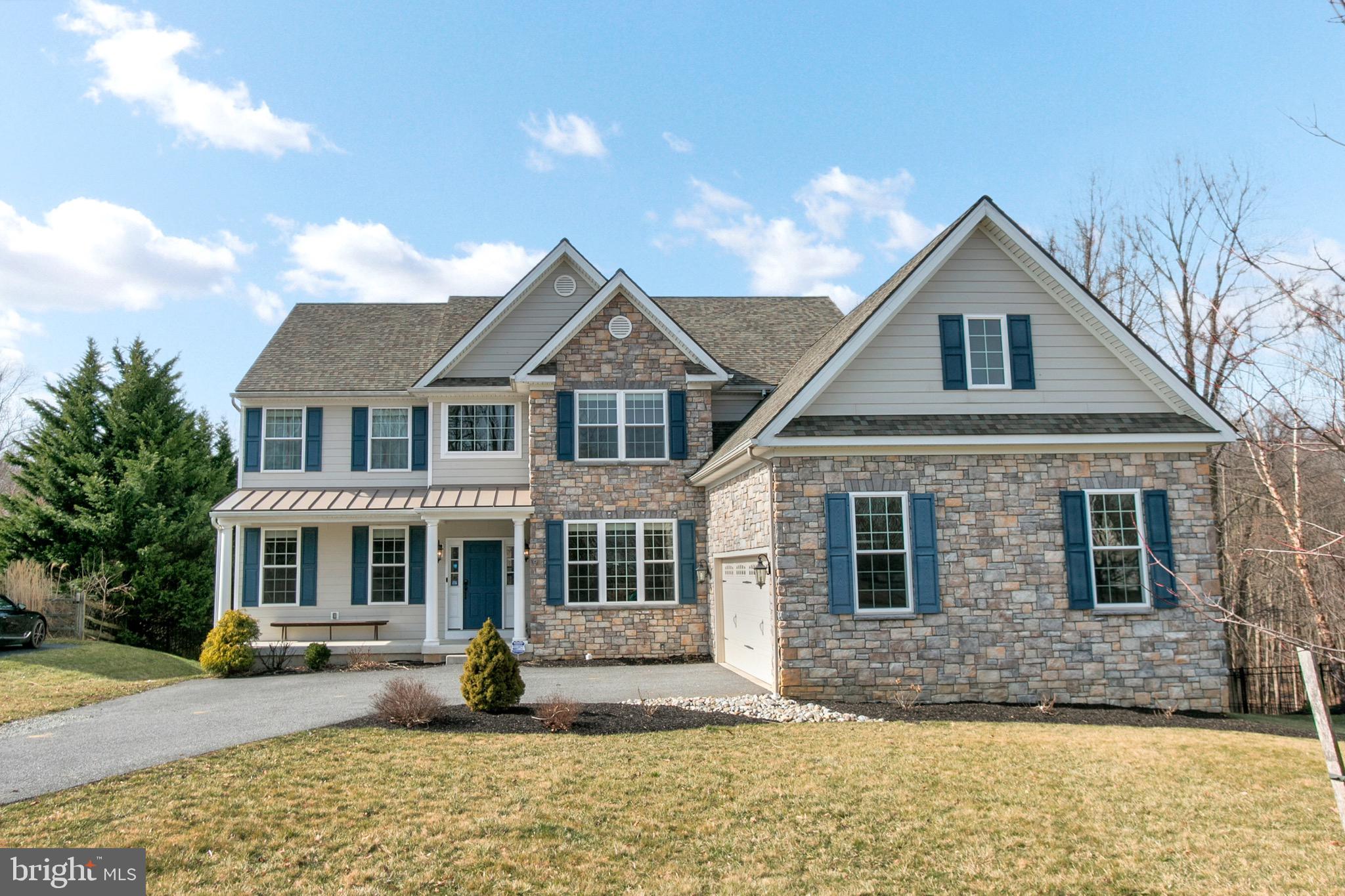View true 360 virtual tour here:  https://exp---scott-deputy-exprealty-com.vr-360-tour.com/e/UVIBcZwplCM/e  Check out this dynamite home in Pennsylvania's wildly popular Garnet Valley.   Only a relocation makes the special home available for a lucky new owner.   This 5 year old home was the last home built in the cozy community of Martins Court.  The two story center hall entry welcomes you to this lovely home that is comfortable in every aspect.   The entry hall is flanked on one side by a formal sitting room with oversized windows.  The other side welcomes you to the spacious formal dining room that features a dramatic tray ceiling with crown moulding, as well as chair rail and picture moulding that add to the aesthetic appeal of this room.  The gourmet kitchen features updgrades including semi custom cabinetry, upgraded stainless steel appliance package, and a bar height center island with pendant lighting above.  The kitchen also features plenty of room for a casual dining space that looks out through the triple french door that pulls in the natural views from the rear of the property.  The kitchen area is open to the beautiful great room that features a gas fireplace with a palladium style window just above that is the perfect centerpiece of this space.  The main floor also features a bedroom with a full bath right next door that can serve as guest quarters or the home office.  Just down the hall from the kitchen there is a large pantry area, laundry room and mudroom with custom built ins.  Upstairs this unique home features four large bedrooms and an open loft area that has endless possibilities including the current use as a children's play area.  The owner's suite features a tray ceiling and a luxurious en suite bath.  The en suite features his and hers vanity areas with granite tops, and semi custom cabinetry.  This bath also features a glassed in shower with marble tile surround, an oversized soaking tub, marble tile flooring, separate water closet, and multiple closets.  The walk in closet is more than generous and features custom Elfa buit ins.  The adjacent bedroom also has an en suite bath.  Just across the loft area are the remaining two bedrooms which share the hall bath that features a dual bowl vanity and tile flooring.  Downstairs there is a newly finished recreation area that adds tons of living space and is perfect for the home theater or endless other uses.  This space also features a full bath with stand up shower and because this space is a true walk out, there are plenty of windows to bring in the natural light.  Outside, there is a lovely deck constructed of composite materials that captures the private wooded views.  The spacious backyard feels extremely private and features a children's playset, decorative aluminum fencing and an electric fence system.   This one truly features the finest amenities in the perfect setting.   This Garnet Valley location keeps you close to major roadways, shopping, restaurants, green space, and top rated schools.  Come see all this beautiful home has to offer.