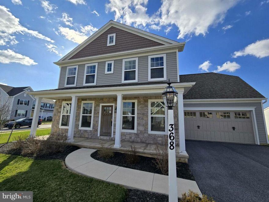Welcome to the Glen Mary Heritage at Spring Meadow Reserve – a beautiful model home that showcases the design and craftsmanship that EGStoltzfus is known for.
Located in the highly sought-after Cumberland Valley School District, this 5-bedroom, 3-bath home – featuring a first-floor guest bedroom and full bathroom – is available now for immediate move-in. 
Starting with the outside curb appeal – the stacked-stone facade, Craftsman-style front door, and carriage-style garage door set the tone for what’s inside. 
Walk onto the covered front porch and into a home that opens up beautifully with 9-ft. first-floor ceilings and rich engineered hardwood floors throughout the main level.
The heart of the home is the spacious family room, anchored by a gas fireplace and two windows that bathe the space in natural light. A cozy reading nook extends off the family room, with an oversized picture window and built-in bookcases – a space you’ll never want to leave.
The kitchen is equally impressive, featuring Cadet Grey cabinetry, New Caledonia granite counters, a herringbone subway ceramic tile backsplash, and a GE stainless steel appliance package with a gas range, dishwasher, French door refrigerator, and outside-vented microwave. 
Three pendant lights anchor the kitchen island, and the roomy eating area opens to a 16x10 paver patio, which is perfect for outdoor dining or entertaining. A butler’s pantry with several cabinets and a large walk-in pantry offers plenty of extra storage to keep the kitchen space organized and clutter-free.
A study with double doors offers a quiet first-floor workspace. 
For guests or multigenerational living, the first-floor bedroom with full bath is conveniently tucked near the rear of the home for added privacy and independence.
Upstairs, the spacious owners’ suite is a comfortable retreat with a large walk-in closet and spa-inspired bathroom. 
Three additional bedrooms, a full bathroom with double-bowl vanity, and laundry room complete the upper level. 
The full unfinished basement is ready for the buyer’s vision – home gym, rec room, or additional storage.
This home is built by EGStoltzfus – a highly regarded, family-owned builder with over 55 years of experience crafting quality homes across central Pennsylvania. 
From your first showing to closing day and beyond, the EGS team is committed to transparent communication, excellent craftsmanship, and a customer experience rooted in integrity.