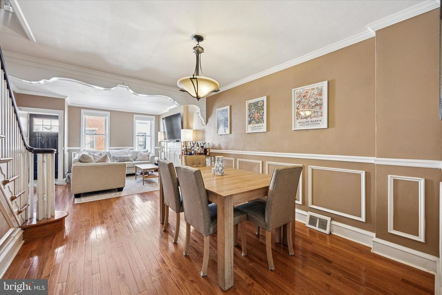 Welcome to this charming 2-bedroom, 1-bathroom row home that perfectly blends original character with modern updates. Step inside to find a warm and inviting living room and dining room featuring gleaming hardwood floors and timeless architectural details. The updated kitchen boasts white cabinetry, granite countertops, stainless steel appliances, and direct access to a private outdoor space—ideal for entertaining or enjoying a quiet retreat. Upstairs, you’ll find two comfortable bedrooms and a beautifully updated bathroom. The lower level provides a laundry area and plenty of storage space. Full of charm and move-in ready, this home is a wonderful opportunity to own a classic residence with today’s conveniences.