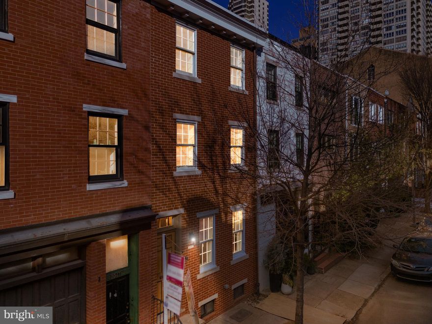 Welcome to 2045 Rittenhouse Square, an exquisite residence where contemporary elegance converges with urban sophistication. Spanning nearly 2,300 square feet, this meticulously crafted 4-bedroom, 2 1/2 bath home offers a perfect blend of style, functionality, and thoughtful design. As you step inside, the first floor beckons with its seamless oak hardwood flooring, leading you through the heart of the home – the chef's kitchen. Equipped with a top-of-the-line Thermador appliance package, quartz countertops, and upgraded fixtures, the kitchen sets the stage for culinary excellence. Adjacent to this culinary haven, a spacious living area provides an inviting atmosphere for relaxation and entertainment. Just off the kitchen, discover a sleek powder room adorned with a bespoke full granite sink basin, adding a touch of sophistication to the main level. The well-appointed bathroom is conveniently situated on the first floor, ensuring accessibility and convenience for residents and guests alike. Step outside to your private English garden-style back patio, providing a serene retreat for alfresco dining and relaxation.  Ascend the solid oak floating stairs with a custom handrail to explore the upper levels of luxury. The second floor hosts two bedrooms that share a beautifully tiled bathroom, showcasing high-quality finishes and meticulous attention to detail. This shared space provides a harmonious living environment, promoting comfort and convenience. The remaining levels continue to impress, with the fourth bedroom on the third floor boasting its own balcony, ideal for an office or nursery. The opulent primary bathroom features a walk-in shower with multiple heads, a dual vanity, and upgraded lighting fixtures. Custom-built closets throughout the home ensure ample storage, enhancing overall functionality. Smart home technology, including Nest thermostats and an "on-demand" hot water system, seamlessly integrates modern convenience. Dual HVAC system promotes energy efficiency. The finished basement offers additional space for a media room or home gym, expanding the possibilities of this exceptional residence. Located in the coveted Greenfield School catchment and approved for tax abatement. Just one block from Rittenhouse Square, this home offers unparalleled access to Philadelphia's vibrant city life, with renowned restaurants and shopping destinations just steps away. Explore the beauty of Schuylkill River Park, conveniently located just blocks from your doorstep.  2045 Rittenhouse Square defines refined living in the heart of the city. Seize the opportunity to make this exceptional residence your own and experience the epitome of urban luxury.  

Seller will pay for 1 year of parking in nearby parking lot of buyers' choice with acceptable offer. *Some photos have been virtually staged.