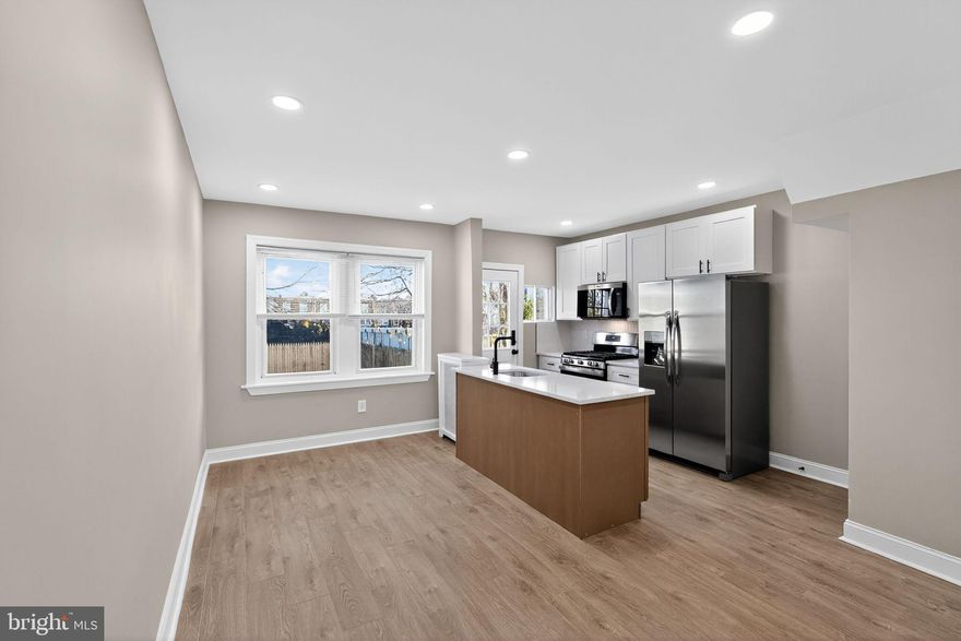 Welcome to 6514 Elmwood Avenue, Philadelphia, PA 19142 — a beautifully renovated three-bedroom, one-bathroom home offering modern finishes throughout.
Step inside to a bright and open main level featuring brand-new laminate wood flooring that flows from the living room through the dining room and into the kitchen. The kitchen stands out with its white shaker cabinets, stainless steel appliances, and a unique two-tone island—a warm wood-tone base paired with a matching white granite countertop—perfect for additional prep space, seating, or entertaining.
Upstairs, you’ll find three spacious bedrooms, each with brand-new wall-to-wall plush carpeting. The fully renovated bathroom offers a clean, modern look with a new vanity, ceramic tile flooring, ceramic tile shower surround, new tub, and new commode.
Outside, the home includes a large backyard, ideal for gatherings, gardening, or creating your own outdoor retreat.
This property is move-in ready and beautifully updated—schedule your showing today!