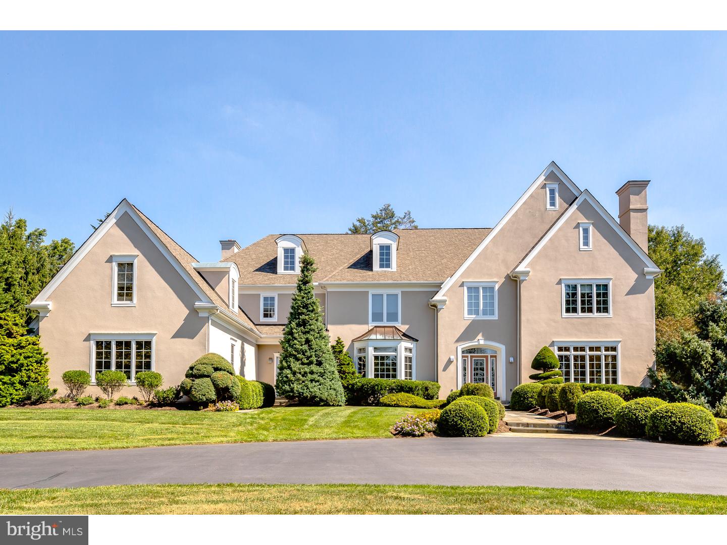 Exquisite Pohlig built colonial with a contemporary flare located on a cul-de-sac in the highly desirable community of Harriton Farm. This gorgeous, just under 7,000 sq ft home is situated on a .82 acre professionally landscaped lot. By far one of the best in the neighborhood. The 1st level boasts a stately center hall featuring a stained glass front door, a grand staircase, arched doorways, crown molding and powder room. The formal DR w/ butler pantry offers a fantastic atmosphere for dinner parties & the elegant LR with gas FP is perfect for those chilly winter nights. A convenient office space can be accessed from the LR or center hall. The gourmet kitchen with Sub Zero refrigerator, Thermodor gas stove & dbl oven, Miele dishwasher, pantry & back staircase to 2nd level also houses a grandiose granite island. Adjacent to the kitchen is the sun-drenched morning room surrounded by 3 walls of windows. The step down lofty FR with soaring ceilings & wood burning FP is equally useful for social gatherings or simply just relaxing. The mud room with 2nd PR, coat closets & access to a 3 car garage finishes off this level. The 2nd level boasts a beautiful Master bedroom with tray ceiling, dressing room with built in cabinetry & drawers & custom his/her walk in closets. The en suite bathroom has a soaking tub, steam shower, a vanity area and separate toilet room. 4 additional BR's & 3 full baths, a laundry room, a computer area w/ built in desks/shelving & access to a walk up attic space for plenty of storage or future expansion completes this level. The finished LL provides further living space as well as a 3rd PR, work out room & a huge unfinished area for more storage. There is also an area that has been plumbed for a potential future bar installation. The expansive yard along w/ flagstone patios, a Sundance in-ground pool w/ retractable cover (new in 2014) & separate in ground spa which can be used year round will allow for countless days/nights of entertaining & outdoor recreation. The home is equipped with a speaker system on the the LL & 1st floor. There is also a central vacuum system through out the entire house. Award winning Lower Merion schools & close proximity to the train, major roadways, the airport & to the quaint town of Bryn Mawr make this a must see home!