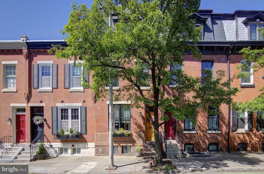 Welcome to 2417 Lombard Street.  This 3-story brick Fitler Square townhome was completely gutted and underwent a meticulous renovation overseen by the current owners in 2017.  With approximately 2,450 square feet of living space this move-in ready gem offers 4 bedrooms, 2 full and 1 half bathrooms, 9’ ceilings on 1st, 2nd, and 3rd floors, finished basement with 8’ ceilings, spacious brick patio with alley access, private fiberglass deck off the primary bedroom suite, and a massive fiberglass rooftop deck affording incredible 360-degree views of the city skyline.  As you enter through the solid mahogany front door and into the open living and dining spaces, you'll notice wide plank hardwood floors, abundant recessed lighting, and an exposed brick wall.  A powder room with pocket door is conveniently located on the way to the oversized gourmet kitchen featuring custom cabinetry, Thermador stainless steel appliances, Carrera marble countertops, pot-filler, center island with Shaws farm sink, skylights, two 8’ tall sliders to rear patio, and a subway tile accent wall. Off the kitchen is a spacious and fenced-in brick patio with alley access. The second floor has hardwood floors throughout and offers a front bedroom with exposed brick wall, a hall bathroom with marble floor and subway tile surround, a hall linen closet, and two additional bedrooms.  The third floor is home to the primary suite with a bedroom area, hardwood floors, recessed lighting, walk-in closet with custom organization system, and a private deck.  The primary bathroom features a huge shower with marble tile surround and frameless glass enclosure, stand-alone soaking tub, Phylrich premium bathroom faucets and tub filler, and a James Martin double vanity.  A staircase from the primary bedroom deck takes you to a large rooftop deck with custom lighting and plumbing rough-in for a wet bar or sink.  The basement was underpinned to allow for 8’ ceilings. It includes a recreation room, laundry area, two closets, and built-in shelving for storage.  Other notable improvements include antique decorative fireplace, exposed brick walls on 1st and 2nd floors, continuous open staircase from basement to 3rd floor, Emtek interior hardware, custom Andersen 400 Woodwright Series windows throughout allowing an abundance of natural light, Control 4 multi-room audio and video system, recessed dimmable LED lighting throughout, and 2-zone HVAC with Ecobee Smart thermostats.  This amazing home is located in the Greenfield School catchment and within walking distance to Fitler Square, Rittenhouse Square, UPenn, CHOP, the Schuylkill River Trail / Dog Park, Markward Playground, Christian Street YMCA, the Goddard School, local shopping, public transportation, numerous neighborhood restaurants, bars, and cafes, and provides easy access to I-76.