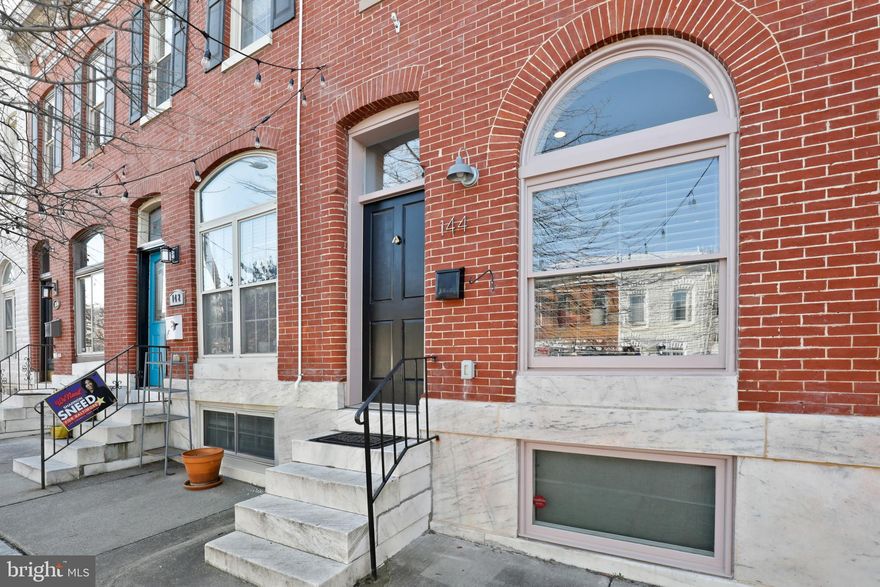 Welcome to 144 N Milton Ave. a must see in person, meticulously updated and lovingly maintained 10 year young CHAP renovation will certainly fulfill any buyers dreams and provide peace of mind.  Located in the heart of the vibrant neighborhood of Patterson Place you'll be a little over a block from Patterson Park and walking distance to many Restaurants, coffee shops and corner bars.  This brick front rowhome welcomes you with it's classic marble front stoop and solid wood front door.  Step through the front door and you're greeted with an abundance of natural light from the oversized front window.  The heart and soul of this home is its captivating open floor plan offering a formal dining space, chefs kitchen with island, flex space for a reading nook or bar area, main level laundry and a half bath.  Outside a sprawling patio awaits offering endless possibilities from relaxation, entertainment or eventually with slight modification a spacious off street parking pad.   The tour continues to the upper level where two exceptionally spacious bedrooms will blow our mind.  Starting at the rear of the home your sanctuary awaits in the owners suite with walk-in closet and luxurious full bath.  Adjacent, discover the second full bath and expansive front guest room with ample closet space and high cathedral ceilings.  Completing the tour is the lower level with another large window filling the bonus  space with warm natural light.  Rounding out the lower level is the lovely third full bath and third enormous bedroom, home office, workout space...what ever your mind can dream up.  Don't miss your chance to make 144 N Milton your home.  Schedule your tour today!