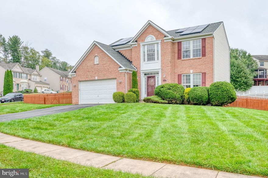 Presenting a distinguished 4-bedroom, 2 full bath, 2 half bath Brick Front Colonial nestled in the sought-after community of Joppatowne. This meticulously maintained residence boasts a wealth of features for comfortable living. The main level welcomes you with gleaming hardwood floors throughout, complemented by plush carpeting in the spacious living room. A formal dining room offers an elegant space for entertaining. The kitchen is a culinary haven, complete with an island and an open layout overlooking the cathedral-ceiling breakfast room, featuring a floor-to-ceiling window with access to the deck. The carpeted family room, conveniently situated off the kitchen, provides a cozy retreat. Upstairs, the primary suite is a private oasis, featuring an attached bath with dual vanity sinks, a soaking tub, a stall shower, and a walk-in closet. Three additional bedrooms share a well-appointed full bath. The fully finished basement adds versatility to the property, offering a recreation area and a theater room for entertainment or relaxation. Outside, a deck provides a delightful space to enjoy the serene surroundings of the fully fenced rear yard. A 2-car attached garage and solar panels contribute to the practicality and efficiency of this exceptional home. Seize the opportunity to call this Colonial gem in Joppatowne your own—a harmonious blend of style and functionality awaits.