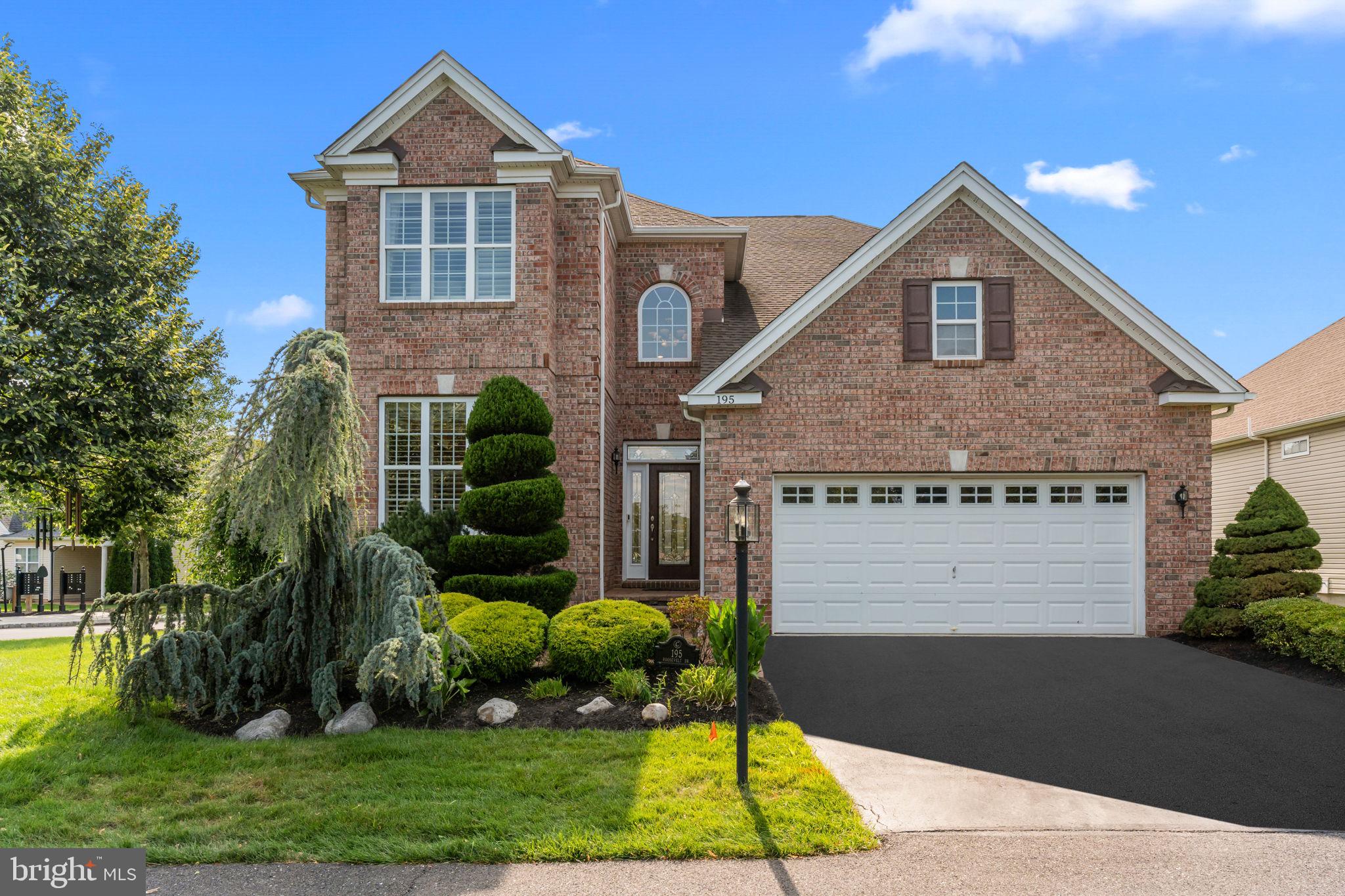 Welcome to 195 Roosevelt Dr – Luxury Living in the Heart of Regency at Yardley
Step into elegance with this stunning Barrington Federal model home, masterfully crafted by Toll Brothers and extensively upgraded with over $100,000 in enhancements. Located on a premium corner lot in the exclusive 55+ gated community of Regency at Yardley, this residence offers sophisticated finishes, thoughtful layout, and effortless main-level living—all just steps from the clubhouse and minutes to major roadways.
From the moment you enter the dramatic two-story foyer, you’ll be welcomed by angled hardwood flooring, stylish custom drapery, and a built-in whole-house speaker system on the main floor—perfect for setting the tone whether entertaining or enjoying a quiet evening at home.
The kitchen is a showpiece of function and style for any home chef with custom 42” cabinetry, gas cooking, a wall oven, a built-in microwave, a warming drawer, and a sunny bay window that floods the space with natural light. A breakfast bar completes the space—ideal for early morning coffee or casual meals.
The expansive two-story living room is centered around a custom marble gas fireplace and opens seamlessly to a backyard oasis featuring nearly $40,000 in custom upgrades—including a paver patio, a built-in paver bar with a granite bar top, a gas grill, a refrigerator, integrated lighting, and an outdoor surround sound system. All patio furniture is included so you can move right in and host your first gathering with ease.
The main-level primary suite is a luxurious retreat with a Closets by Design walk-in closet and a spa-style ensuite bathroom featuring an oversized walk-in shower with custom tilework and a built-in bench seat, dual sinks, upgraded cabinets, and elegant finishes. A second bedroom on the main floor—currently used as a home office—is located adjacent to another full bathroom, ideal for guests or flexible living.
Also on the main level: a separate laundry room (washer & dryer included), access to the 2-car garage, and custom-programmed candle lighting in every front and side window to elevate your curb appeal year-round.
Upstairs, enjoy two more generously sized bedrooms, a third full bathroom, a large walk-in storage closet, and a versatile loft with a Bose surround sound system—perfect for your own private theater or hobby space.
Looking for more room? The full unfinished basement offers an additional 1786 sqft and 10-foot ceilings and is already plumbed for a future bathroom, giving you endless potential to expand.
The home’s custom landscaping is maintained by the HOA for low-maintenance living, and the clubhouse, indoor/outdoor pools, fitness center, and walking trails are just a short stroll away. This home has everything and is the ideal location. A Home Warranty is also included.