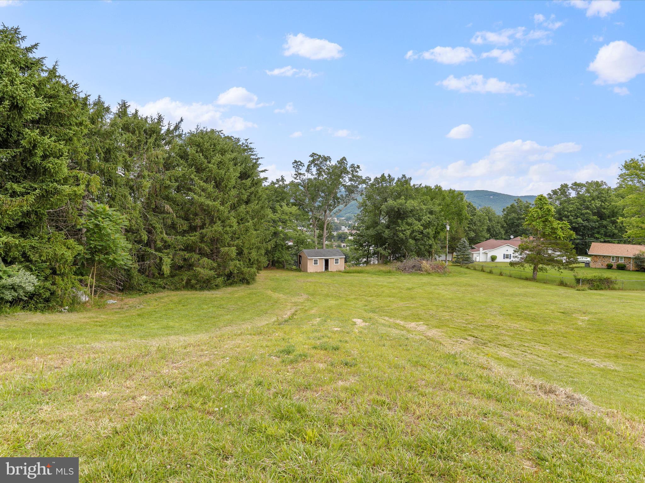 This is an opportunity to purchase a 1.36 acre lot in The Point subdivision on the edge of Petersburg. This property is ready to be built on, has paved road frontage, is mainly cleared and mowed. It has public water and sewer available. Enjoy mountain views and a stunning view of town from the back of the lot, yet in a quiet neighborhood. Tree lined on one side, shed on property conveys as-is. Hospital is under 10 minutes away, close to Smoke Hole, Seneca Rocks, Spruce Knob, fishing, hiking and much more!