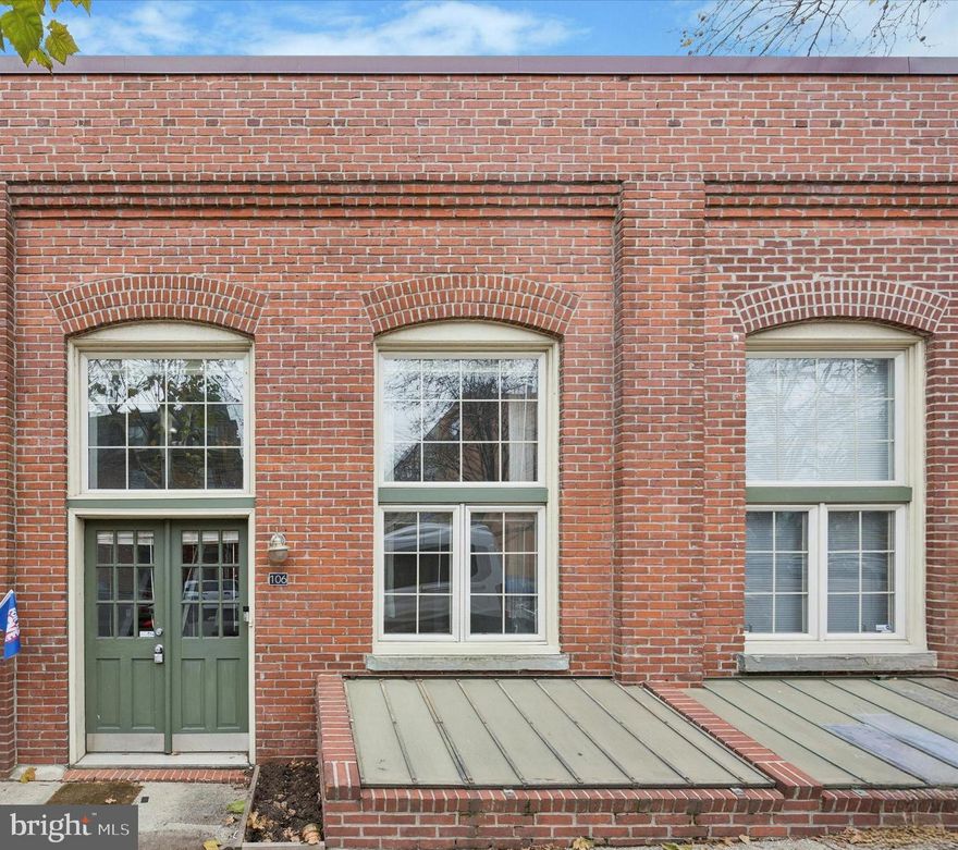 Welcome to your next chapter in the heart of Fairmount—a vibrant, tree-lined neighborhood where history meets modern living. This stunning 1-bedroom, 1-bathroom bi-level condo combines industrial character with thoughtful updates and move-in ready condition. Step inside your private entrance to find an open-concept living space flooded with natural light from an oversized factory-style window and soaring vaulted ceilings with exposed wood rafters. Hardwood floors run throughout the main level, seamlessly connecting the spacious living area to a sleek kitchen with stainless steel appliances, tile backsplash, and breakfast bar seating—perfect for casual dining or entertaining guests. Upstairs, the lofted bedroom feels expansive and inviting with its hardwood floors, exposed beams, custom built-ins, and skylight that fills the space with soft morning light. The full bathroom features modern tile finishes and a shower-tub combo. Additional conveniences include in-unit laundry, a private utility closet for extra storage, and a dedicated off-street parking space—an incredible perk in one of Philadelphia’s most desirable neighborhoods. Enjoy the ease of low monthly condo fees and the unbeatable location just steps from Lemon Hill, Fairmount Park, and Kelly Drive, with easy access to the Philadelphia Museum of Art, and Center City.  Whether you’re a first-time buyer or looking for a low-maintenance city retreat, this Fairmount gem offers timeless charm, unbeatable convenience, and modern comfort all in one. Some of the photos are digitally enhanced.