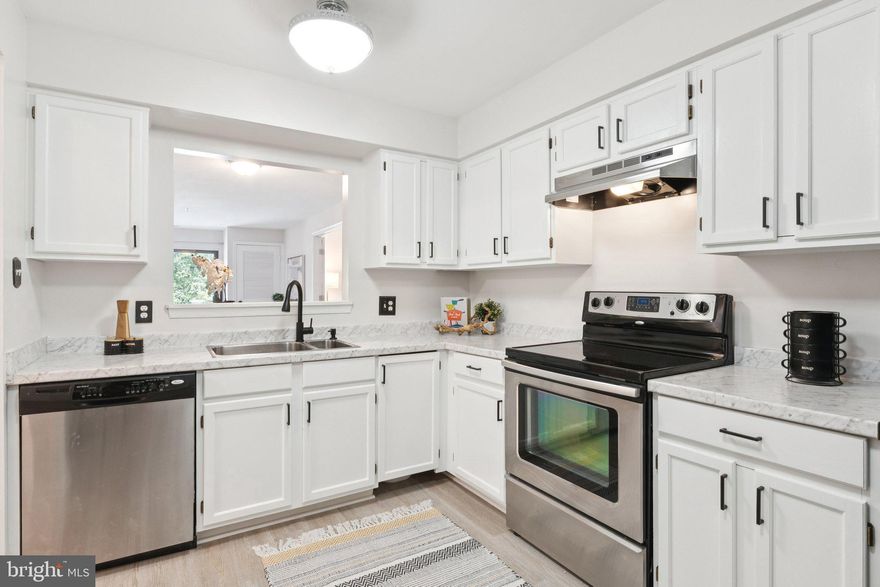 **NEW PRICE** Welcome to your Annapolis retreat—Unit #211 is a bright and breezy 2-bedroom, 2-bath condo with a den, offering the largest floor plan in the community with over 1,150 sq ft. Located in the vibrant and active 55+ community of Heritage Harbor, this home is just steps from the South River and offers an exceptional blend of comfort, style, and resort-style amenities. Inside, you'll find an open layout with brand NEW wide-plank LVP flooring throughout, creating a seamless flow from the spacious living and dining areas to a private balcony perfect for relaxing. The den offers additional living space and has brand new French doors to extra privacy. The updated kitchen features white shaker cabinets, carrara-look countertops, and stainless steel appliances. The primary suite offers a walk-in closet, access to the private balcony, and a beautifully renovated en-suite bath. A full-sized NEW washer and dryer are included in-unit for added convenience, plus one assigned parking space also conveys with the unit. Other updates include fresh paint throughout including walls, ceiling, and trim. The building has recently installed a new elevator and carpet throughout the hallway. Residents of Heritage Harbor enjoy access to a wealth of amenities including pools, tennis and pickleball courts, a 9-hole golf course, kayak launch, boat slips on the South River, a clubhouse with dining, and even RV and boat storage on-site. Whether you're enjoying a quiet morning on the water or an active afternoon on the courts, Unit #211 offers the perfect balance of relaxation and recreation in a picturesque Annapolis setting.