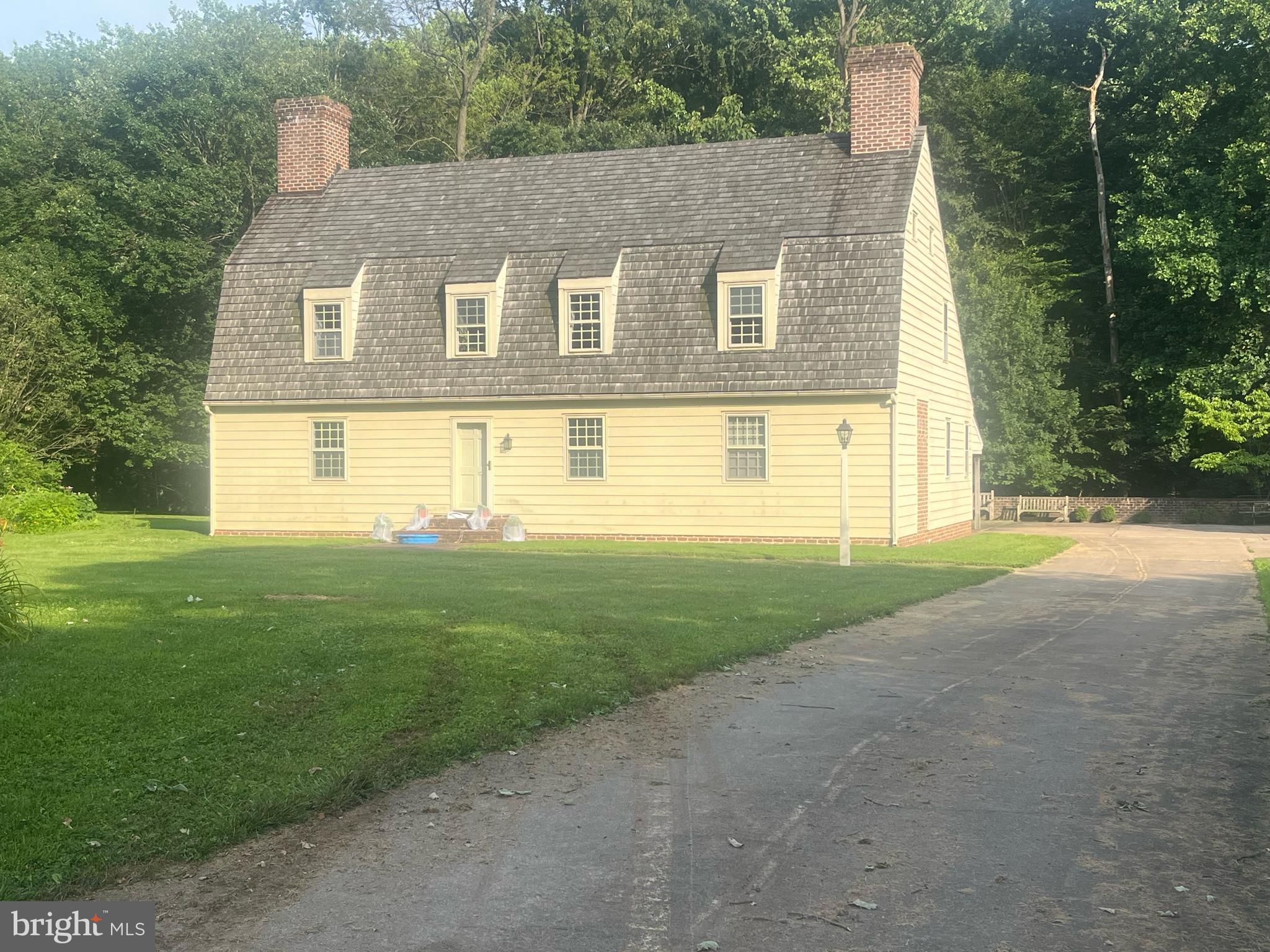 This beautiful 2-acre property in scenic Kennett Township features a custom-built Dutch Colonial reproduction home with a two-car detached garage, nestled among woods and a tranquil stream. Zoned Residential Medium to High Density (RMHD), zoning permits single-family homes, twins, or retirement communities by right. Townhouses (up to 6 dwelling units/acre) or multifamily dwellings (up to 12 dwelling units/acre) are permitted by conditional use. Please note: higher-density uses and subdivision opportunities require acquisition of adjoining parcels (also listed separately). Additional acreage is available - see listings for 109, 114, and 117 Chandler Mill Road. Buyer is encouraged to verify zoning and subdivision requirements with Kennett Township. Located in the award-winning Kennett Consolidated School District, just minutes from downtown Kennett Square, Longwood Gardens, and Route 1.